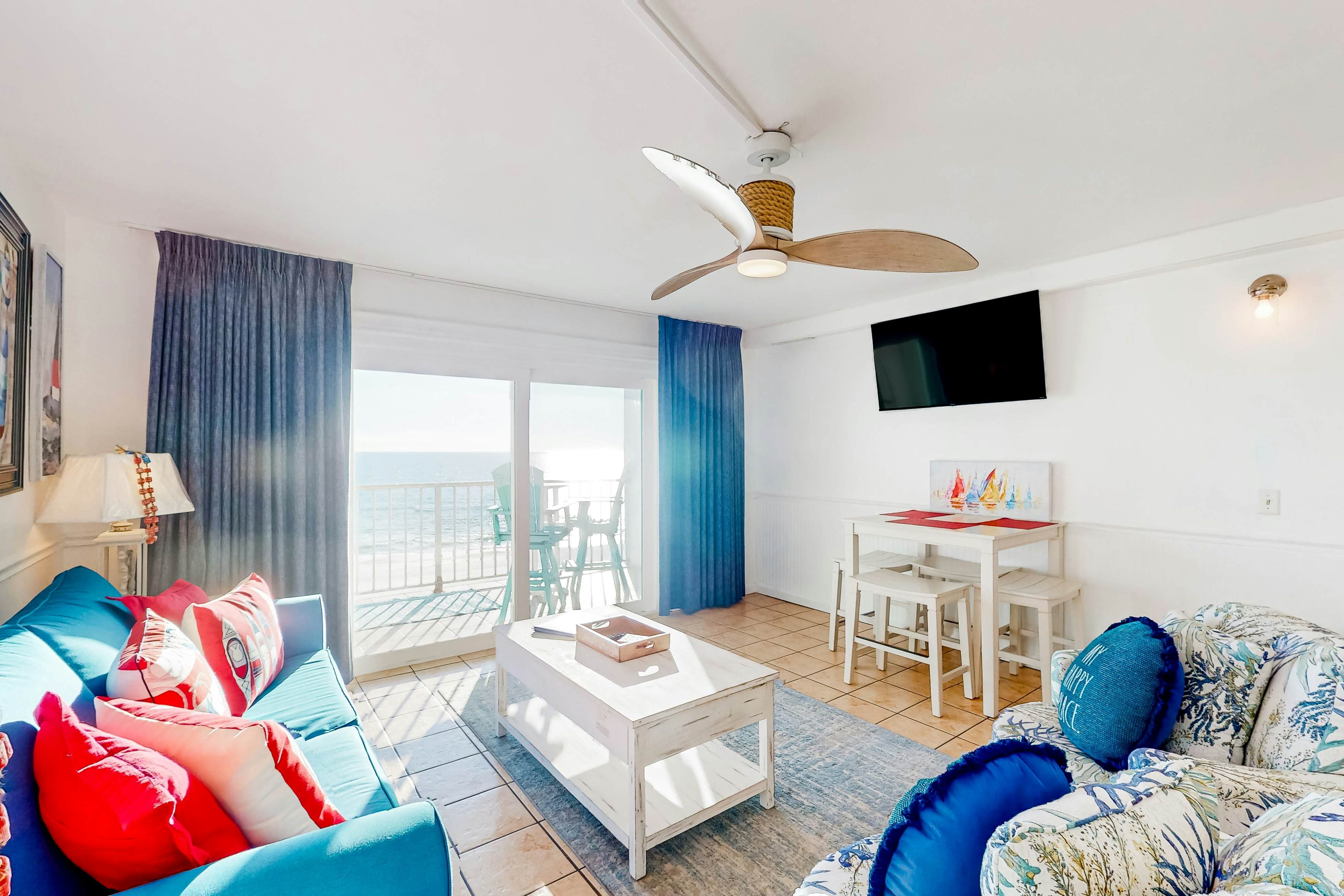 Charming oceanfront condo with open layout, balcony, pool, hot tub, & gym