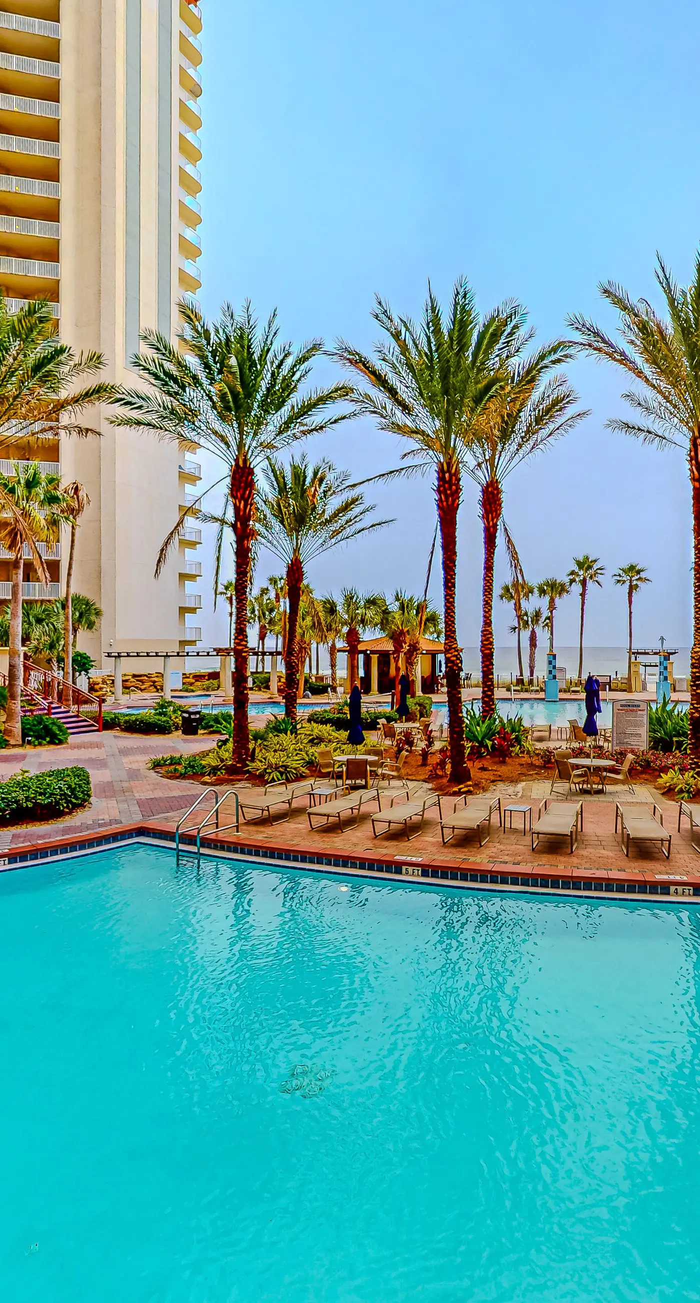 Gulf-front condo with sweeping views, pools, hot tubs, & easy beach