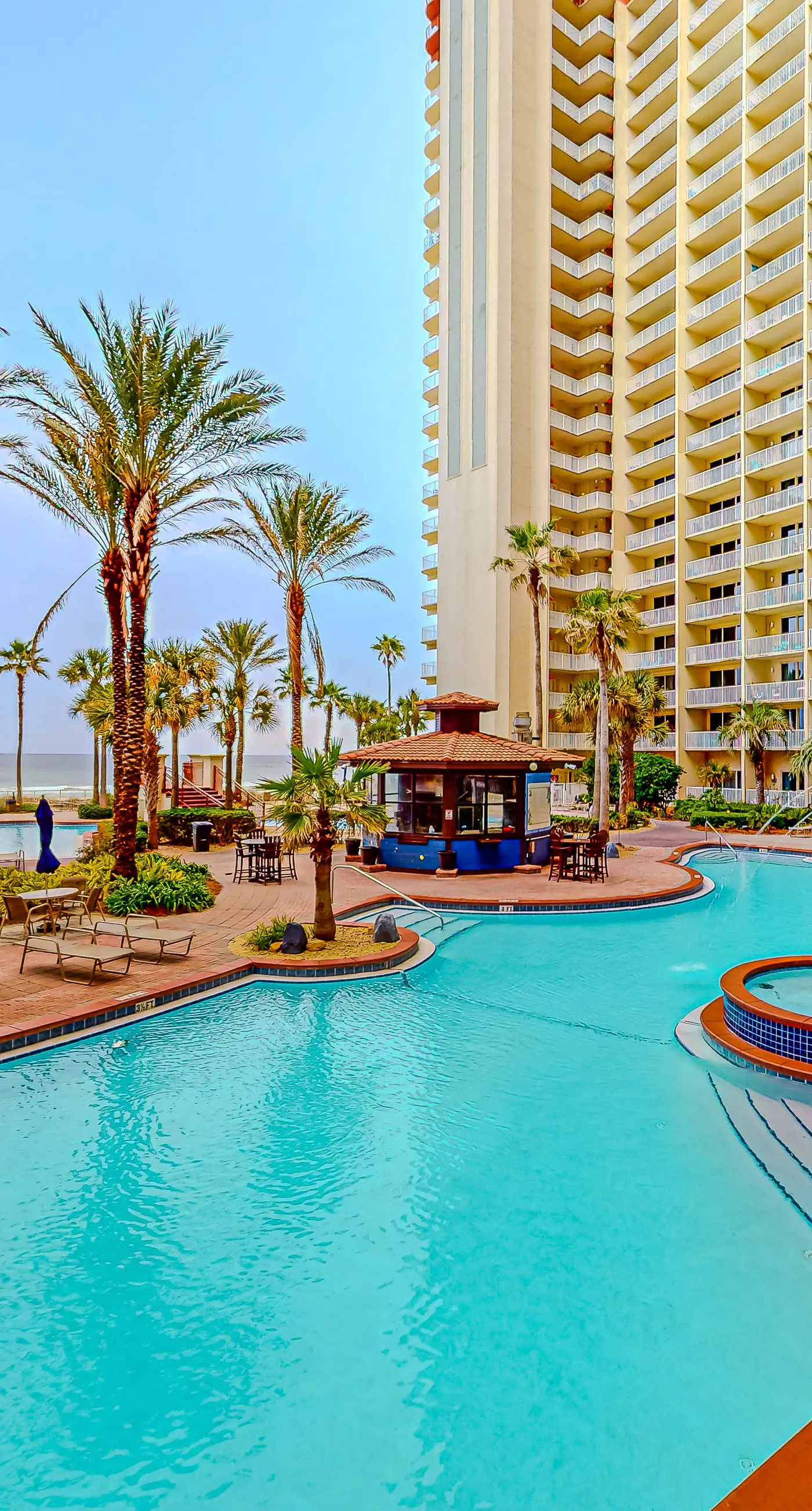 Gulf-front condo with sweeping views, pools, hot tubs, & easy beach