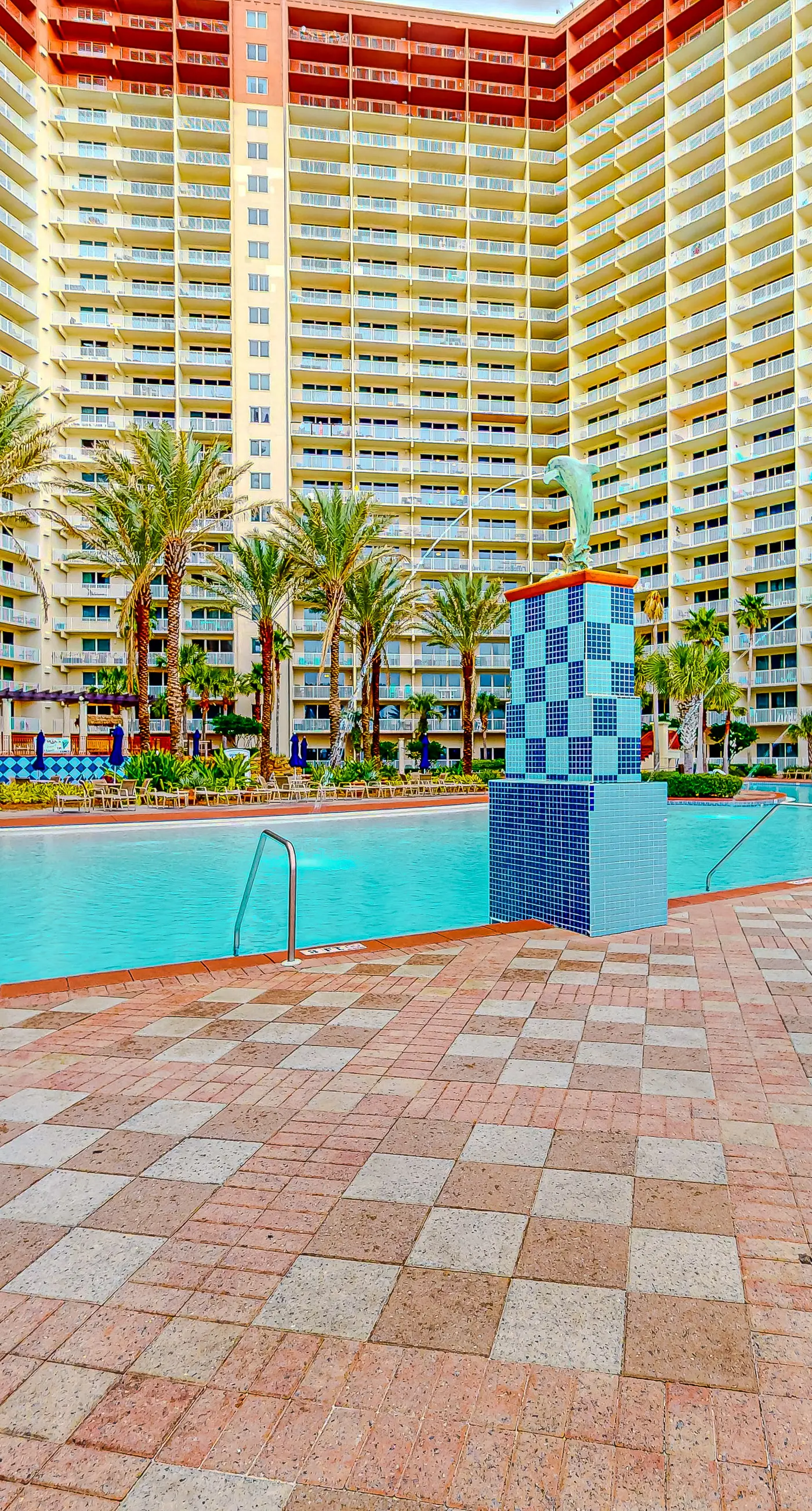 Gulf-front condo with sweeping views, pools, hot tubs, & easy beach