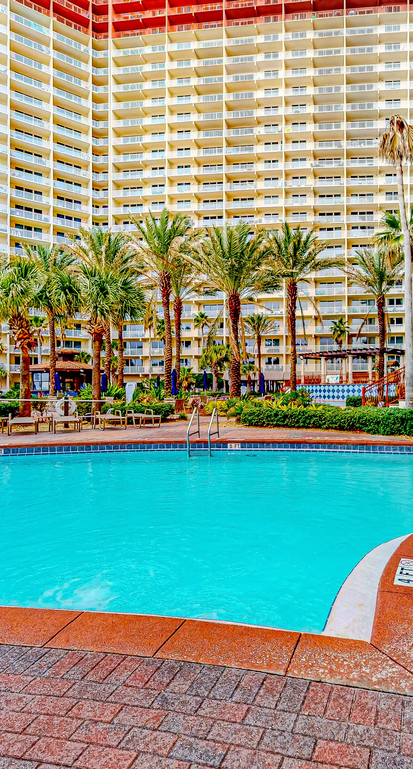Gulf-front condo with sweeping views, pools, hot tubs, & easy beach
