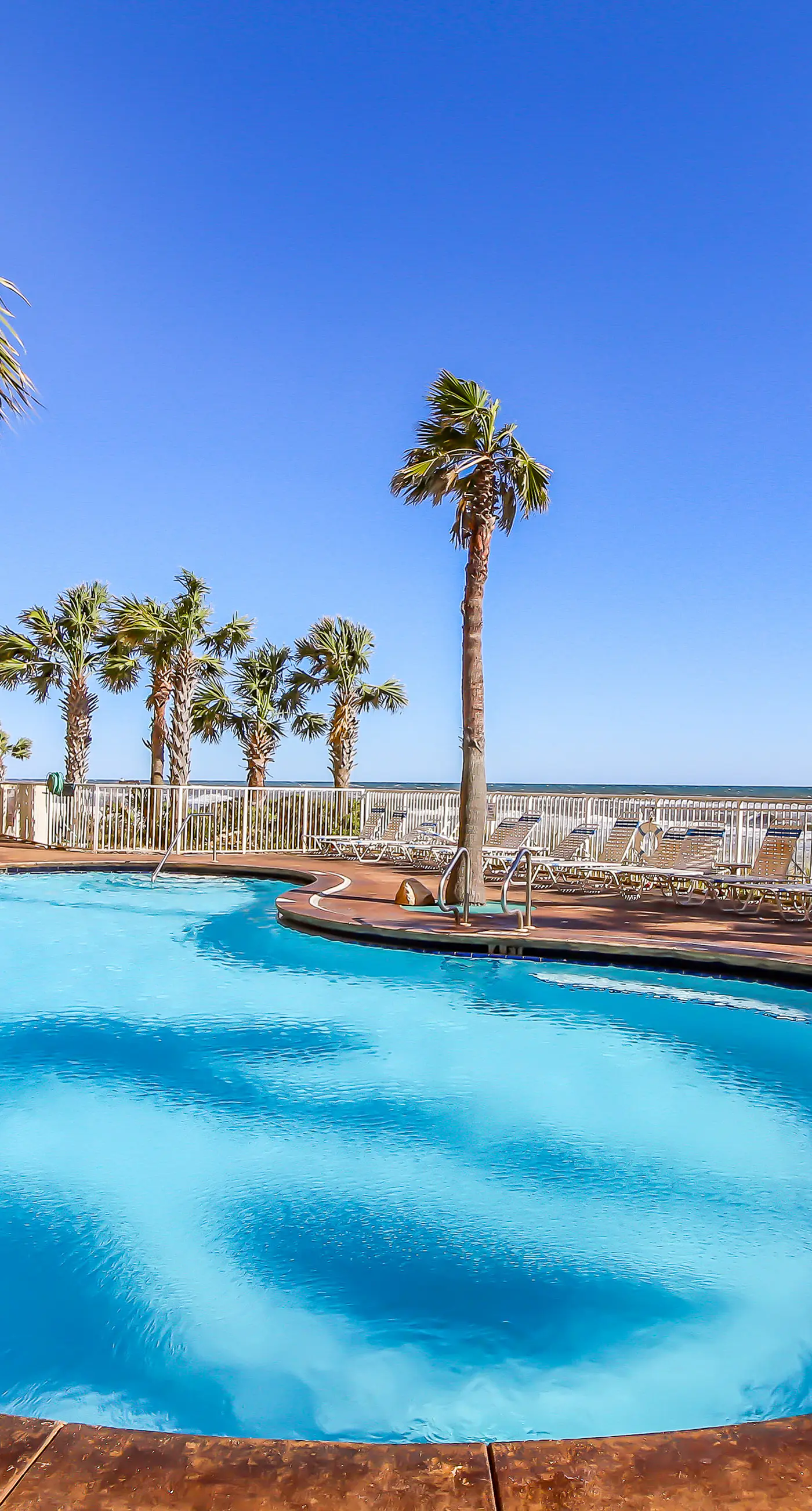 Gulf-front condo with pool, hot tub, balcony, & complimentary beach service