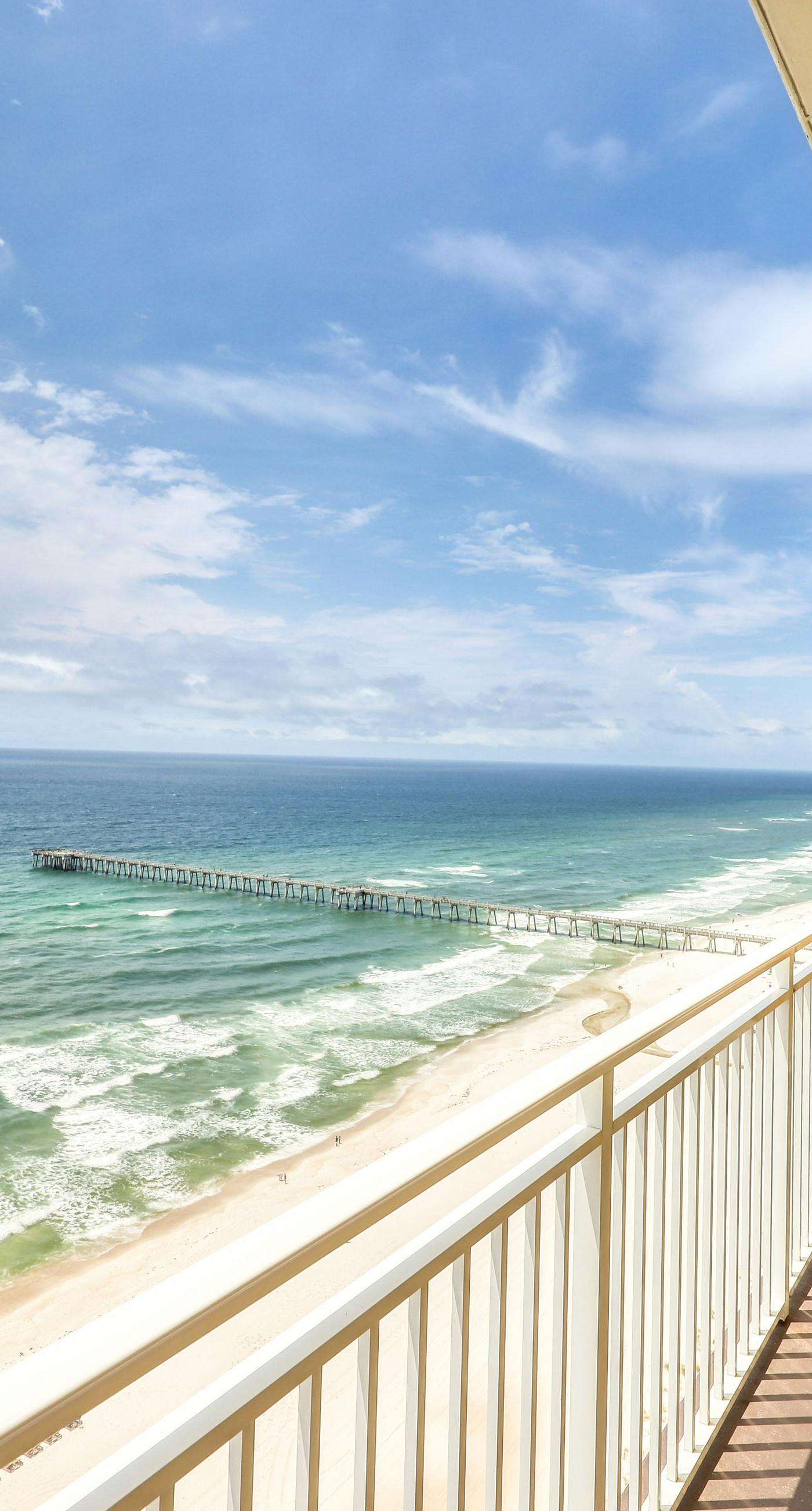 Waterfront condo with furnished balcony, pool, gym & beach