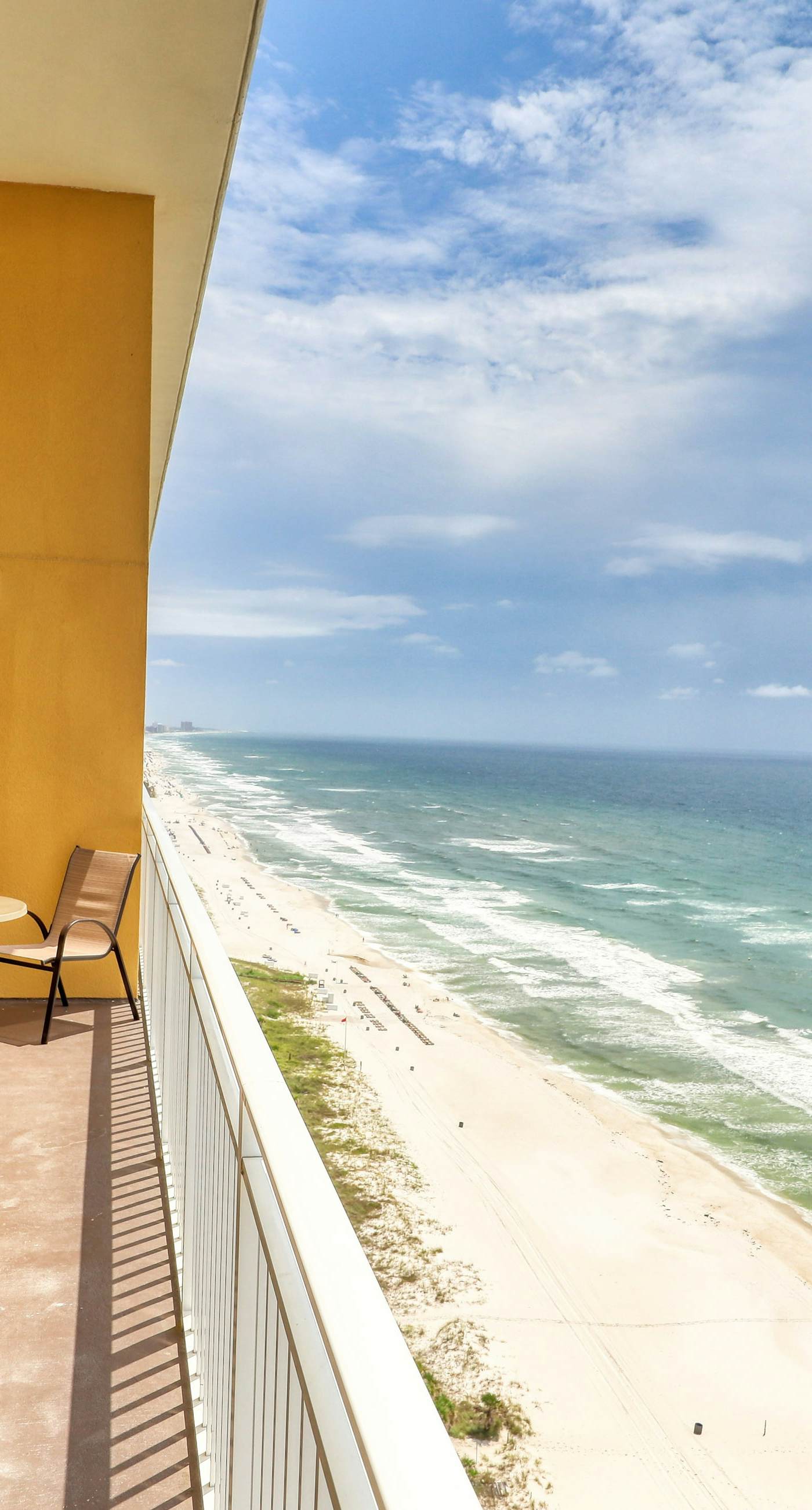 Waterfront condo with furnished balcony, pool, gym & beach