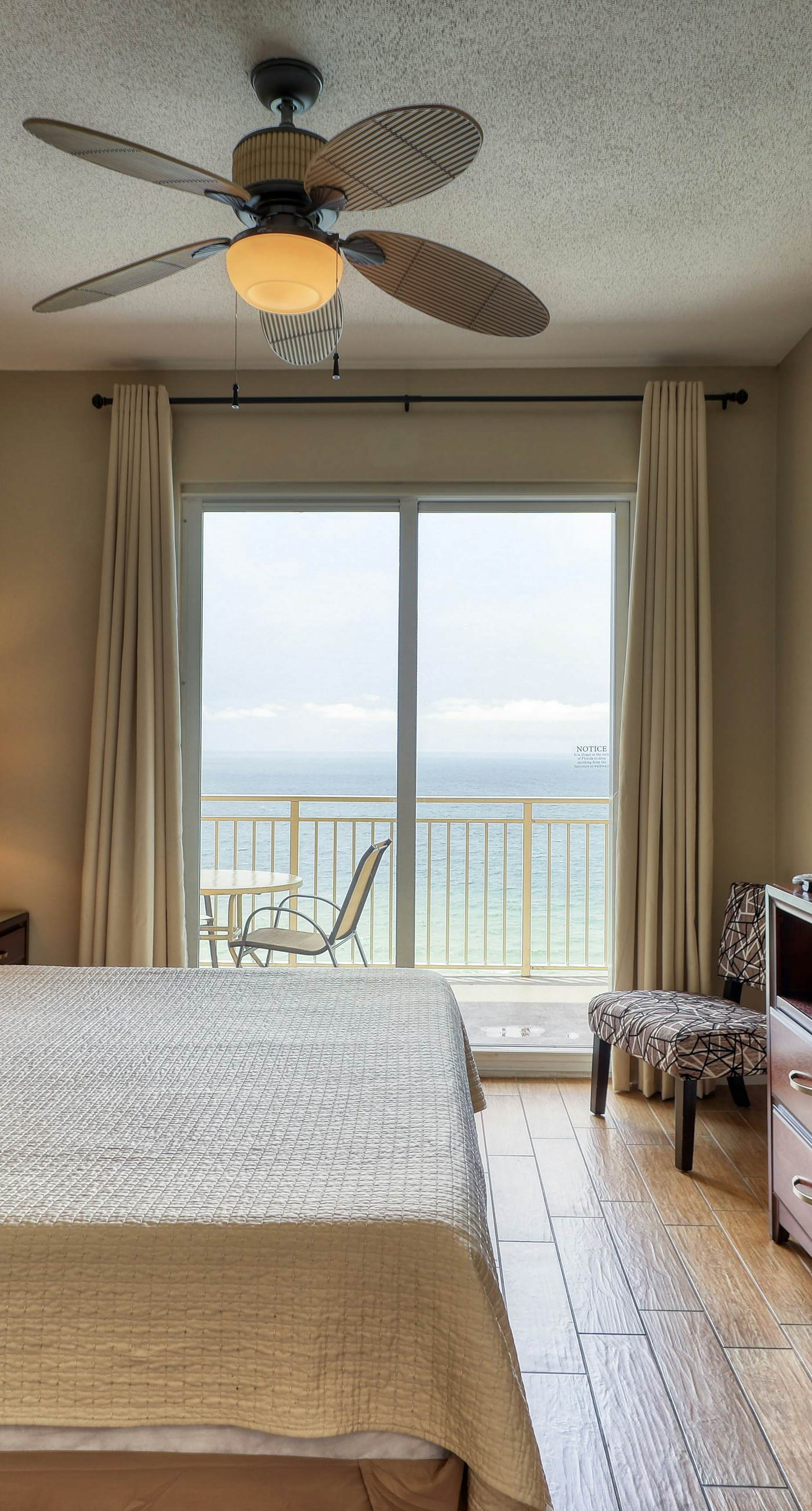 Waterfront condo with furnished balcony, pool, gym & beach