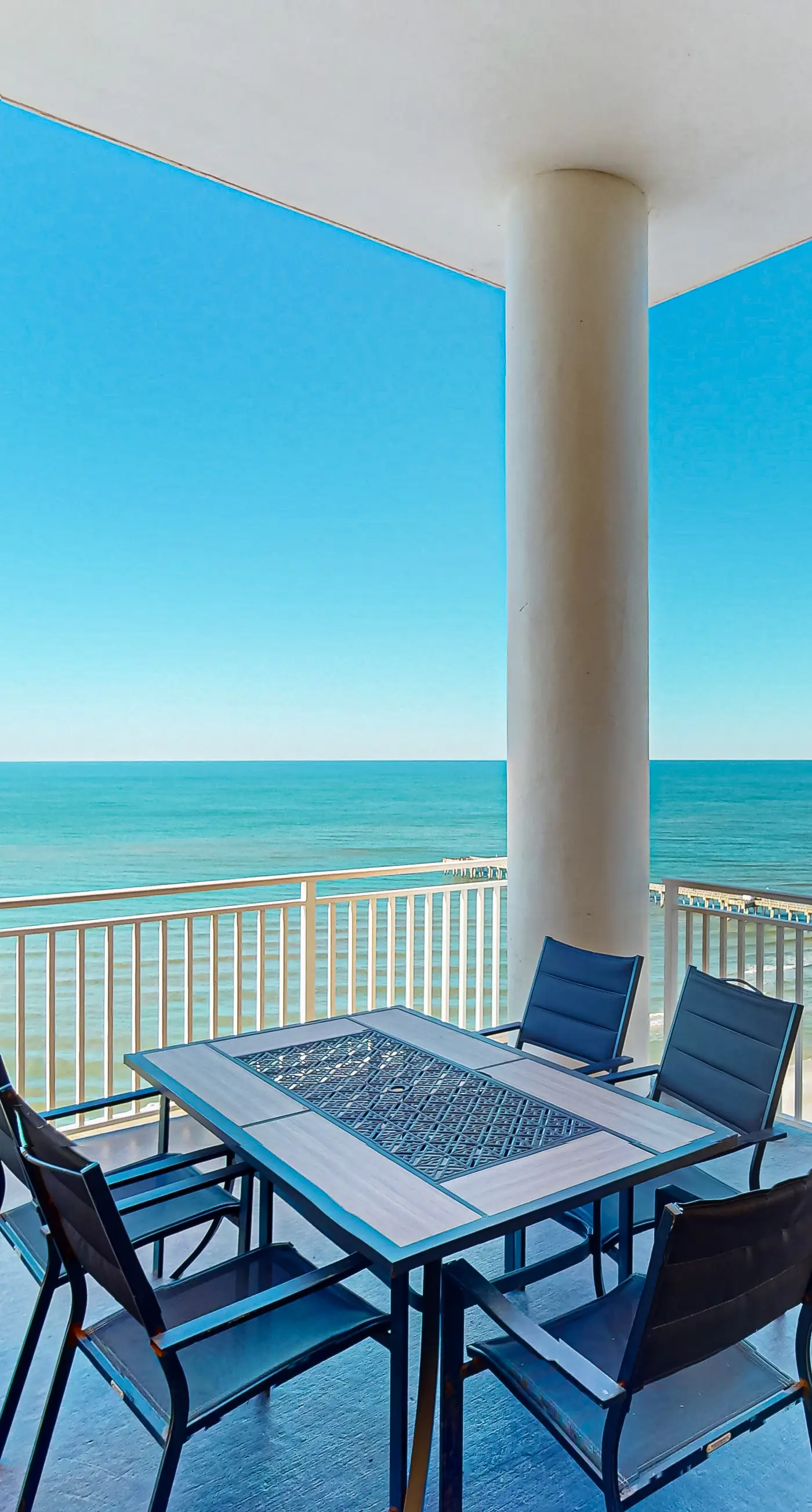High-end beachfront condo with pools & gym - walk to the beach
