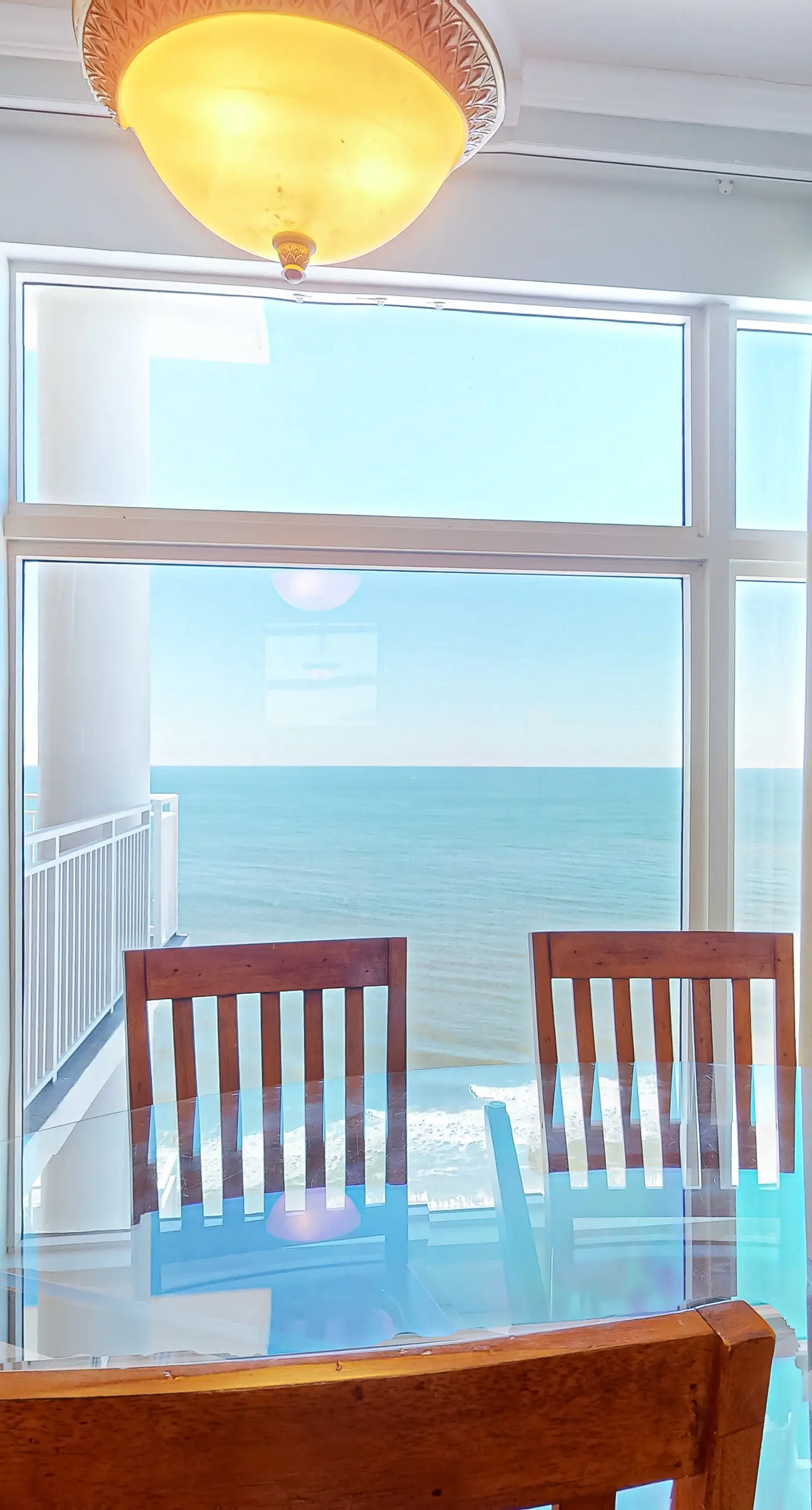 High-end beachfront condo with pools & gym - walk to the beach