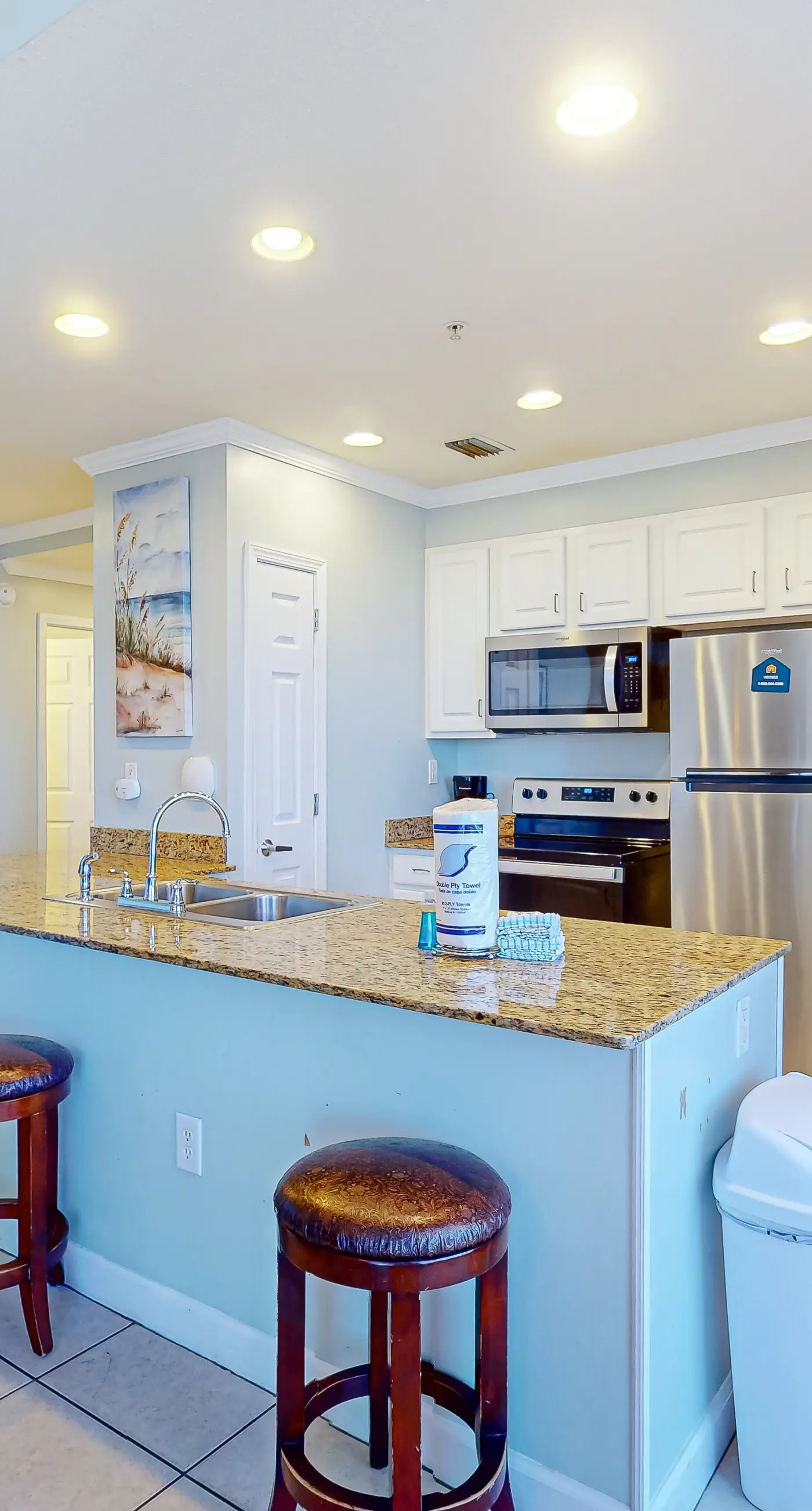 High-end beachfront condo with pools & gym - walk to the beach