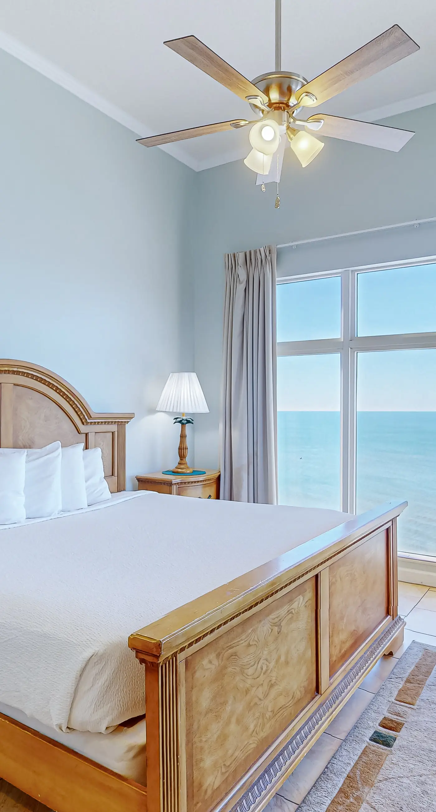 High-end beachfront condo with pools & gym - walk to the beach