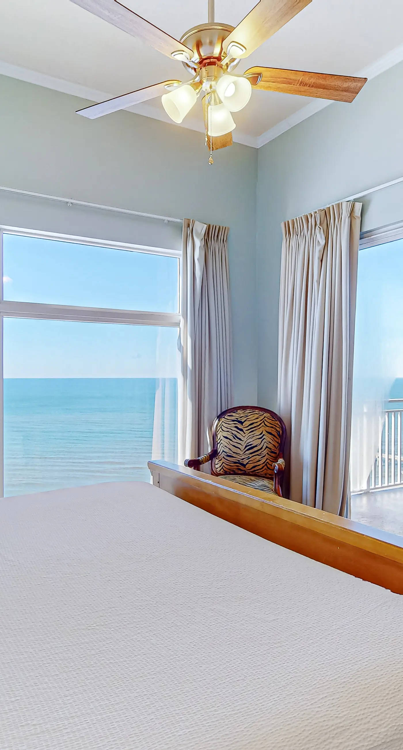 High-end beachfront condo with pools & gym - walk to the beach