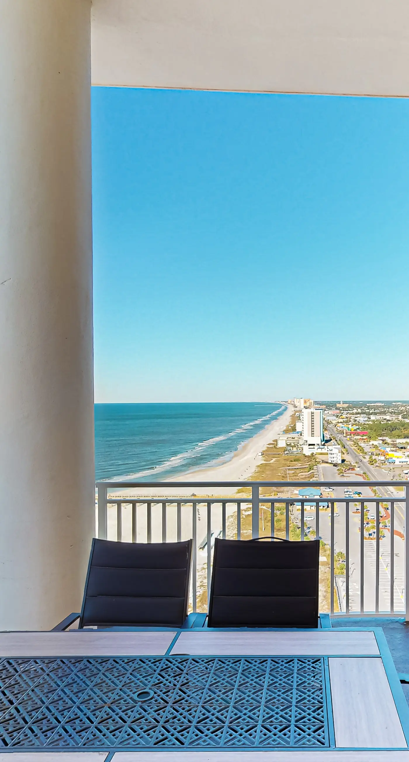 High-end beachfront condo with pools & gym - walk to the beach