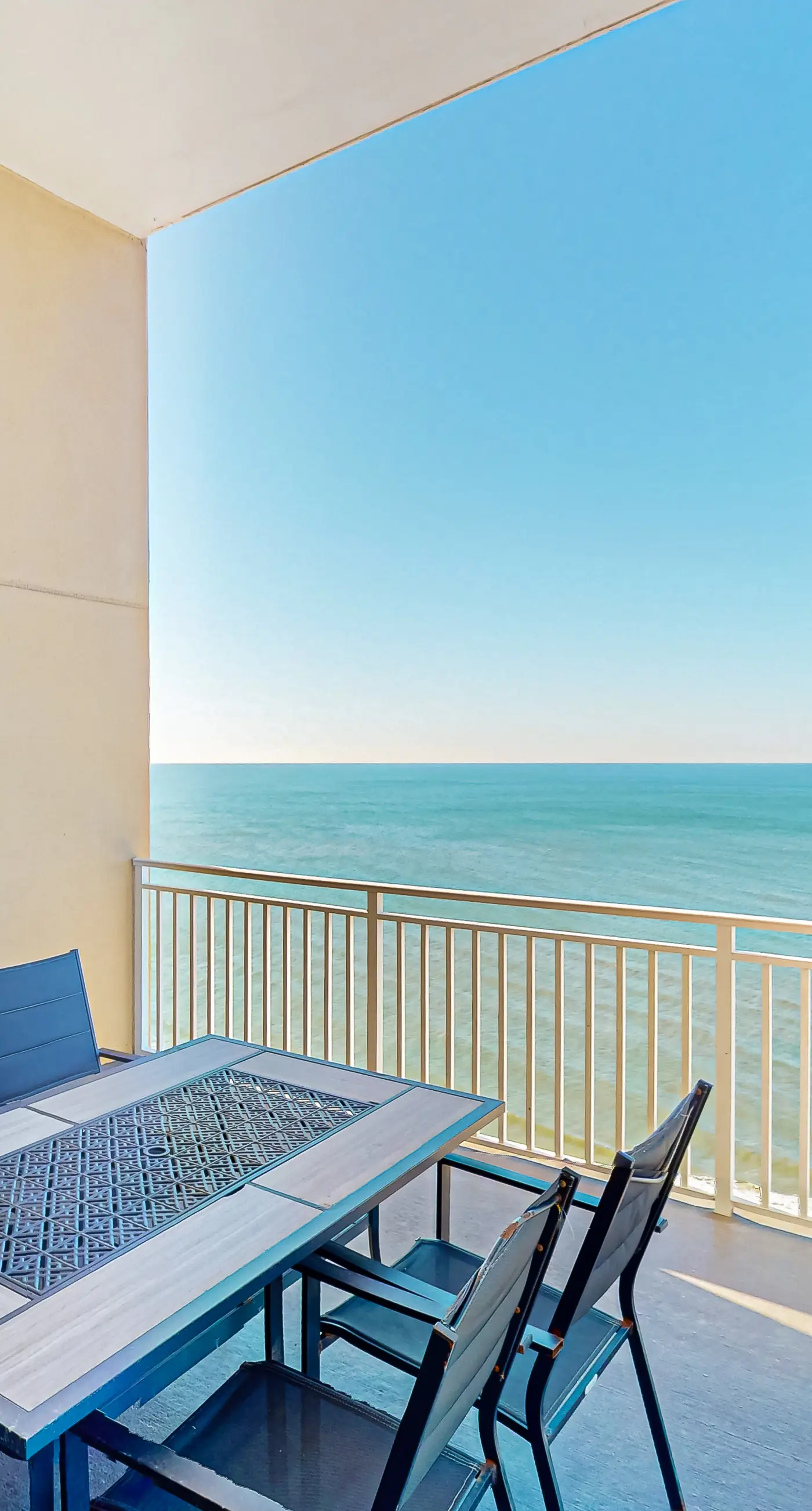 High-end beachfront condo with pools & gym - walk to the beach