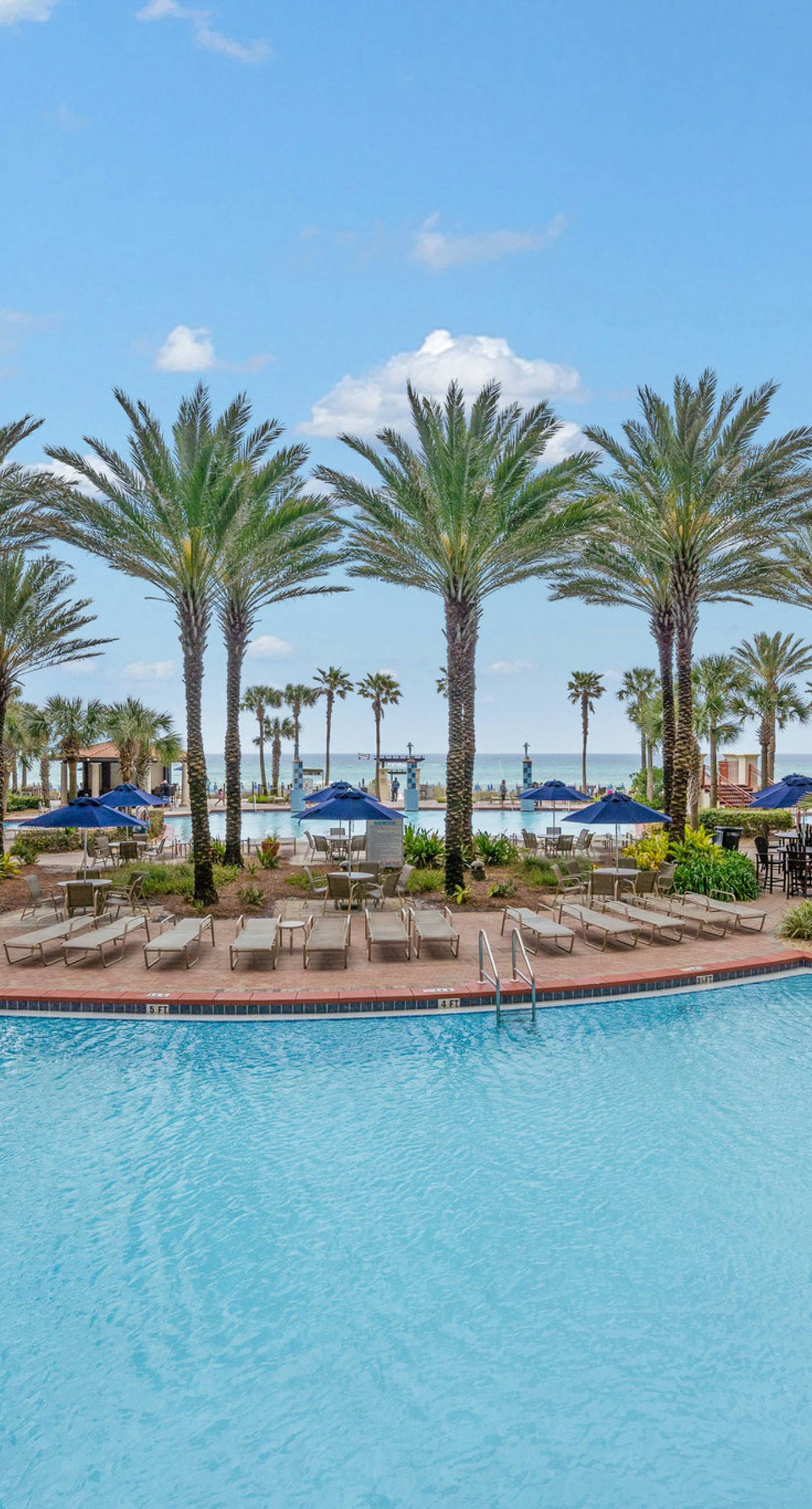 Beachfront retreat with pool, hot tub, gym, & seasonal beach chairs & umbrella