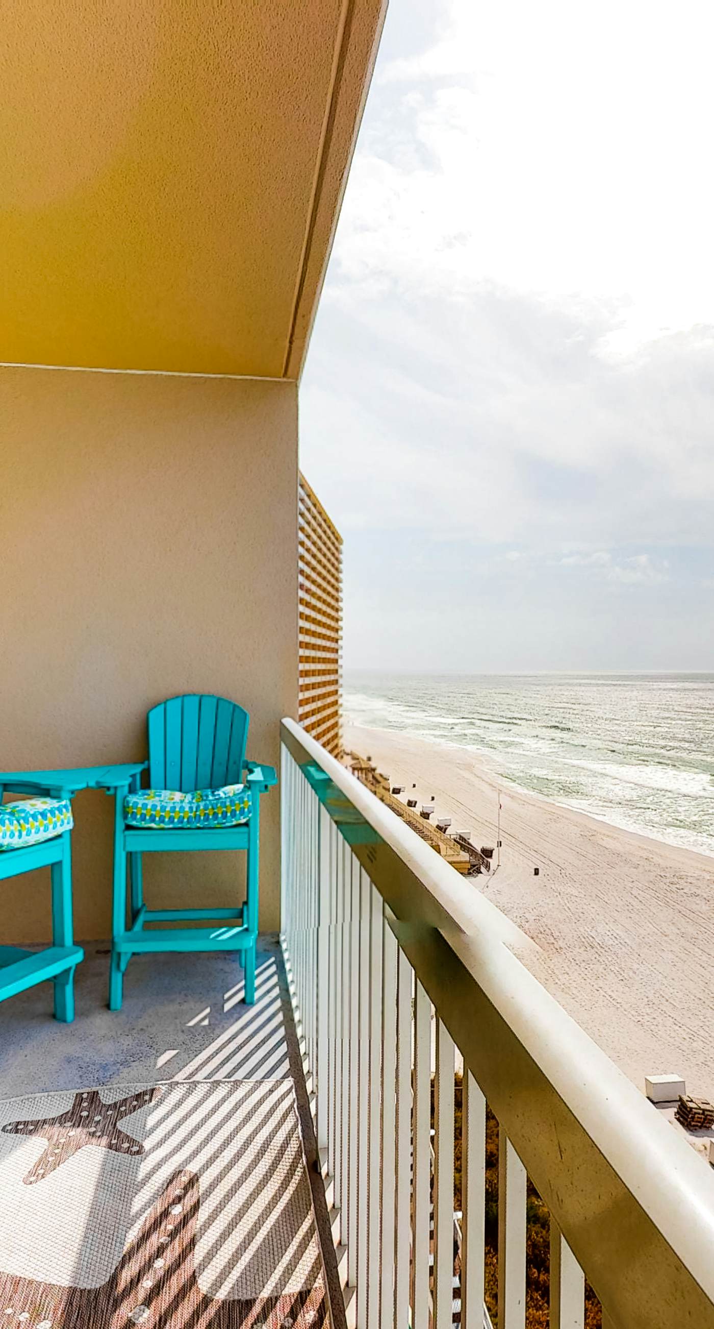 Colorful, waterfront condo with pools, gym, & beach access