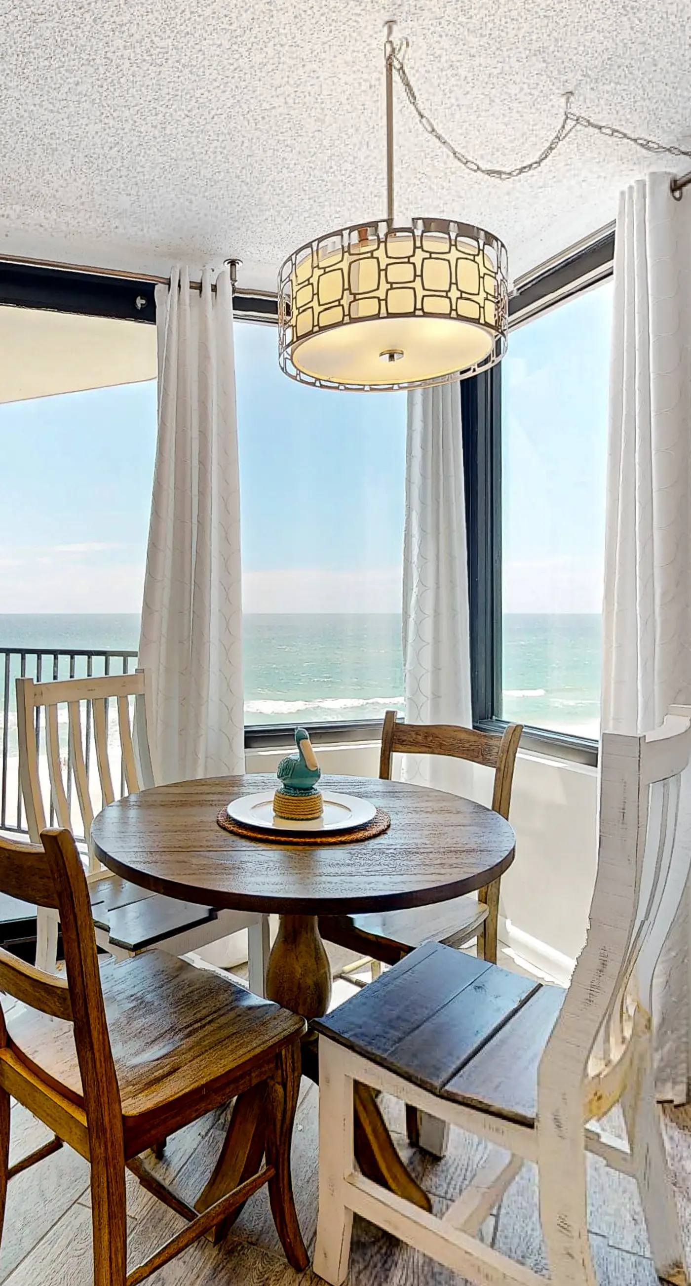 Gulf-view condo with pools, beach access, gym, grills, & updated interior