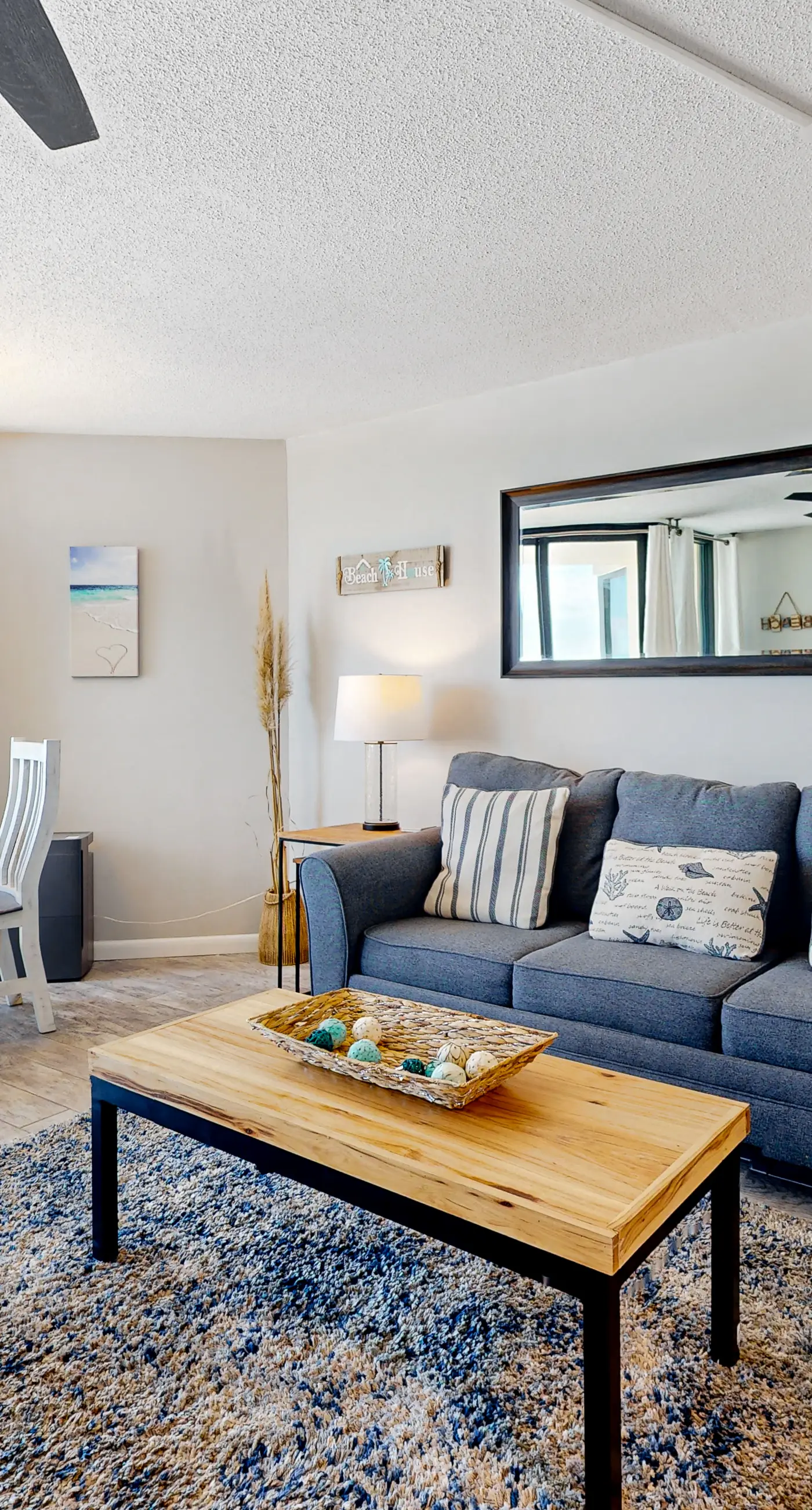 Gulf-view condo with pools, beach access, gym, grills, & updated interior