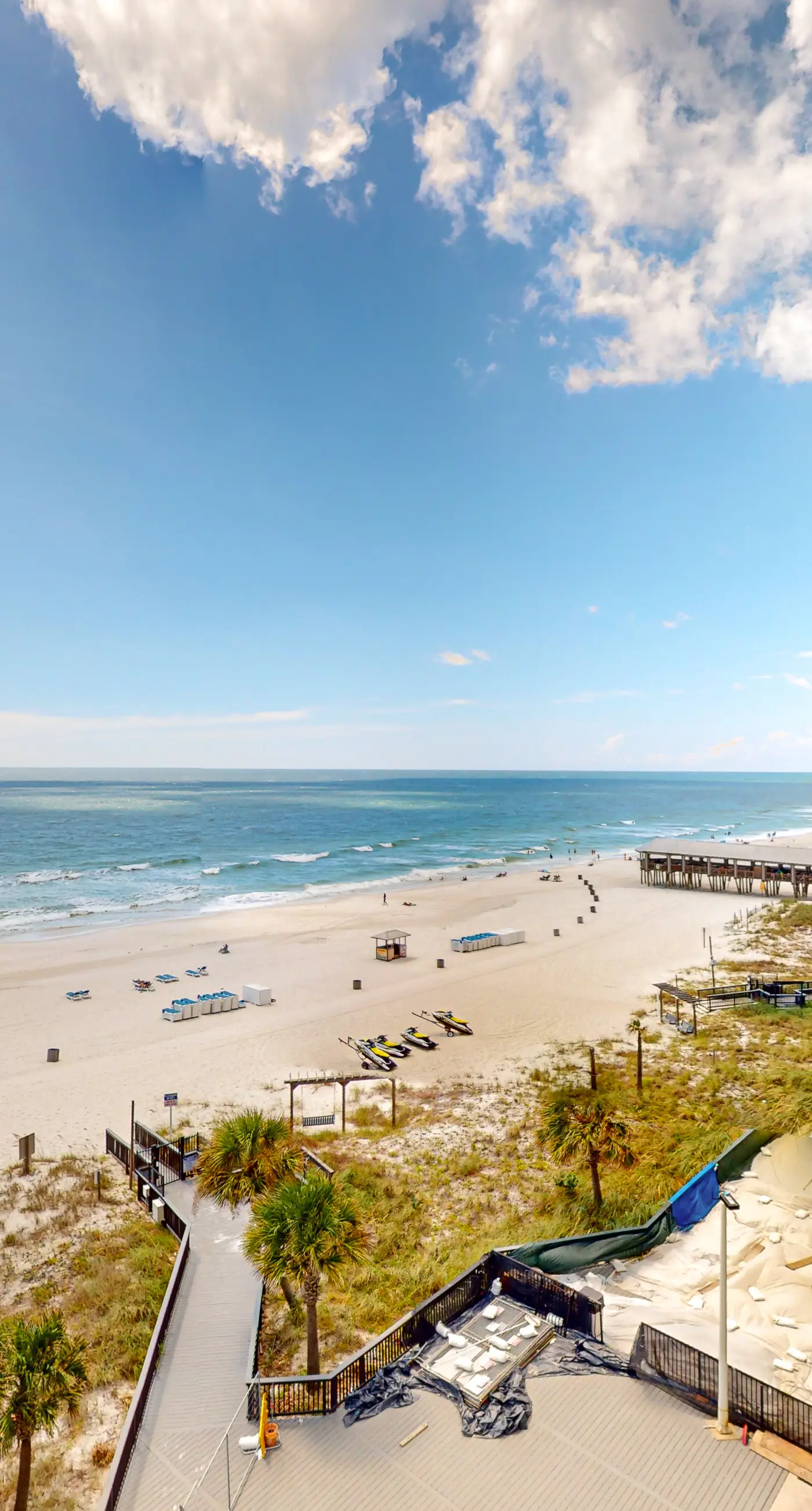 Gulf-view condo with pools, beach access, gym, grills, & updated interior