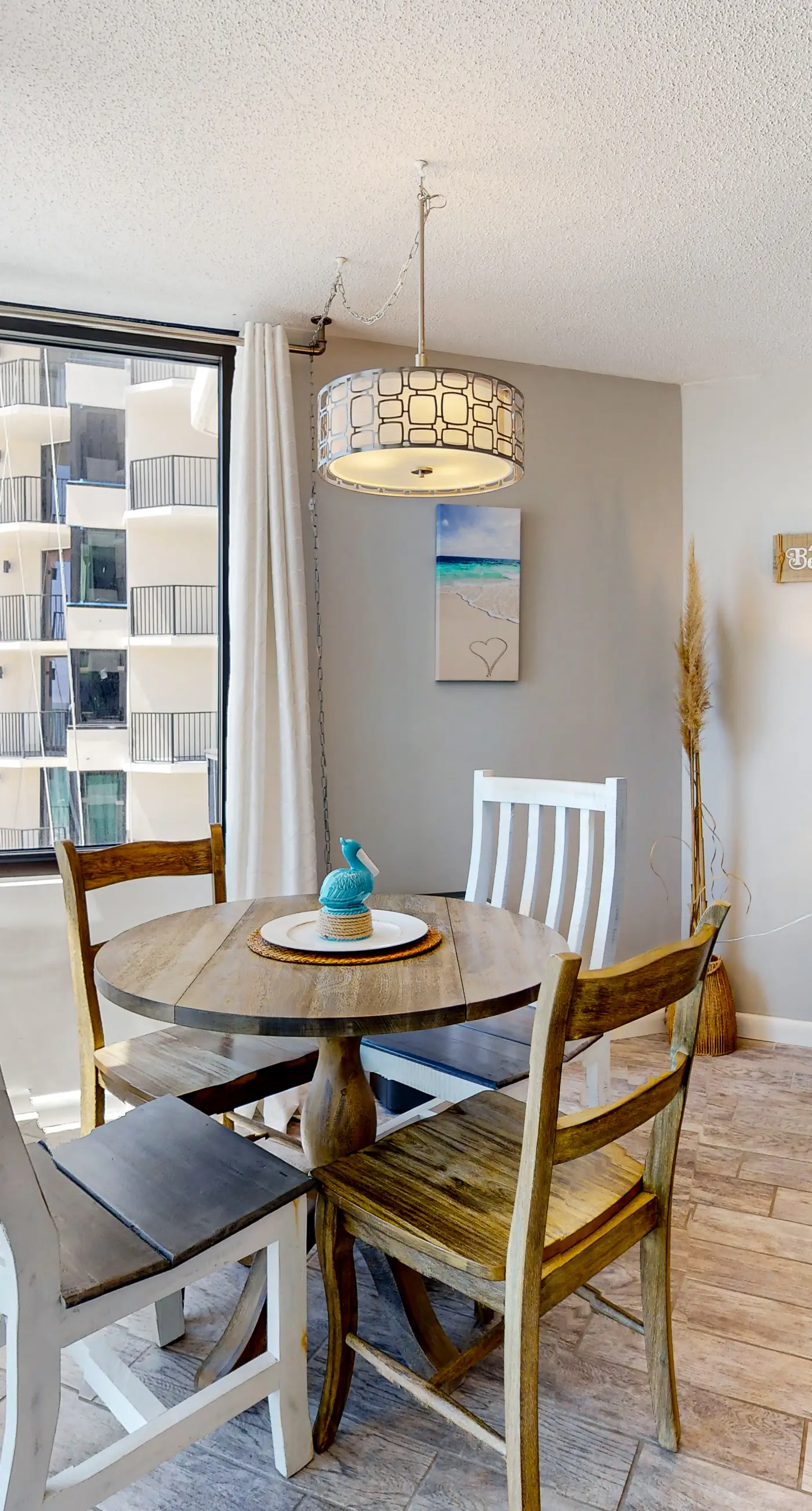 Gulf-view condo with pools, beach access, gym, grills, & updated interior