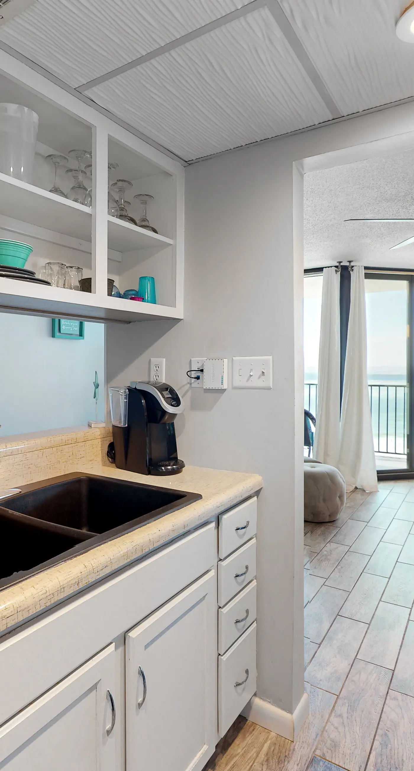 Gulf-view condo with pools, beach access, gym, grills, & updated interior