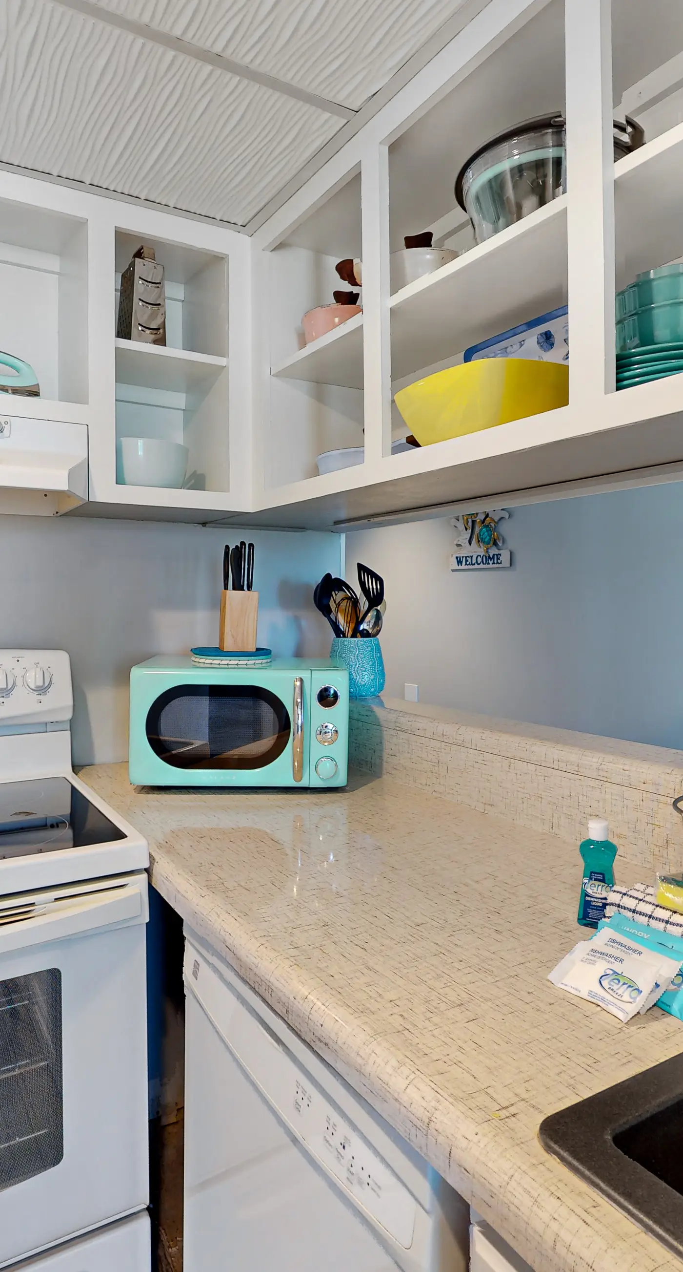 Gulf-view condo with pools, beach access, gym, grills, & updated interior