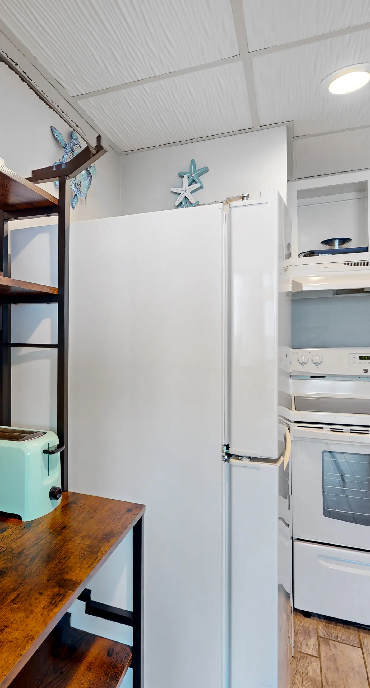 Gulf-view condo with pools, beach access, gym, grills, & updated interior