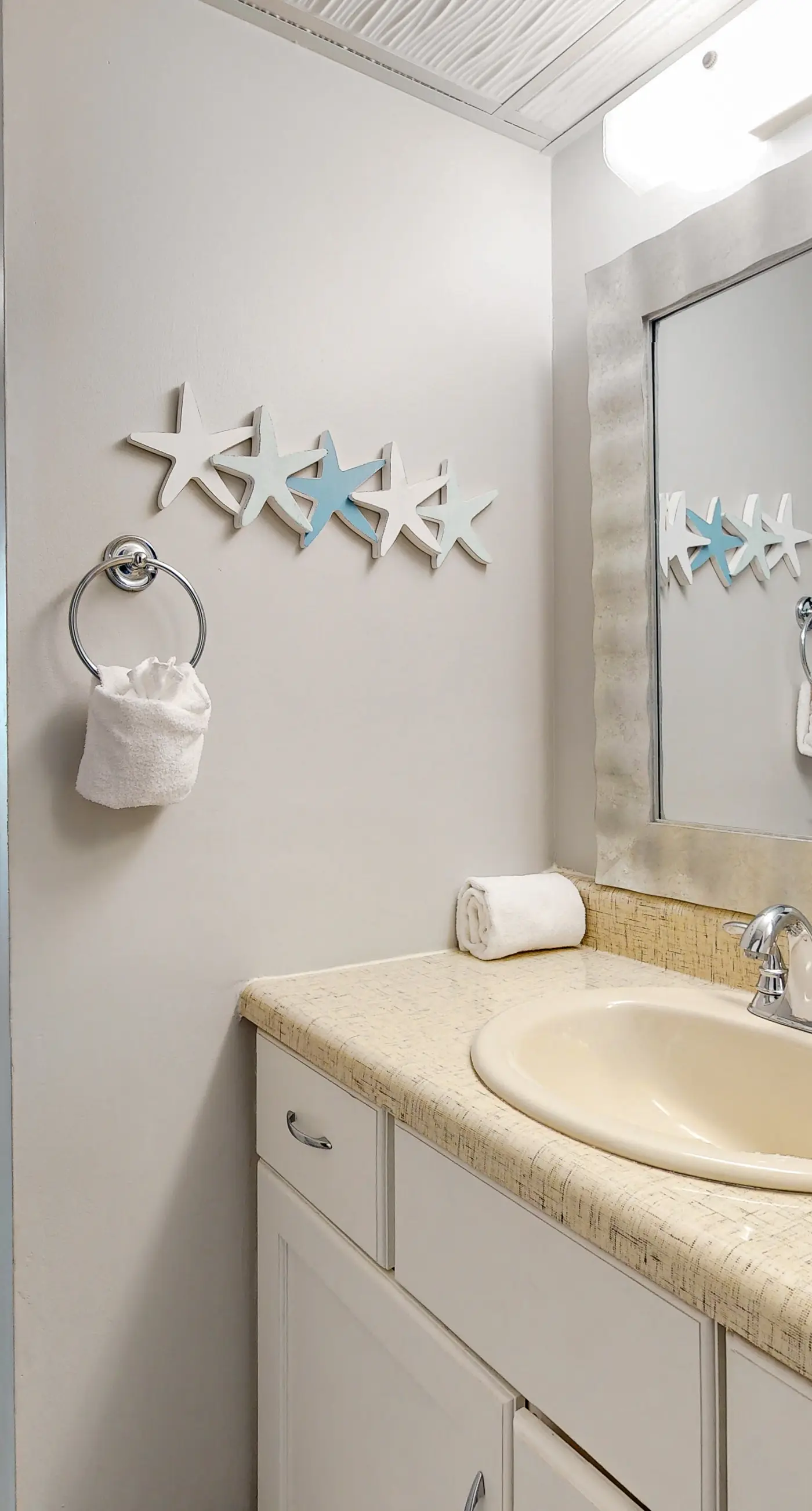 Gulf-view condo with pools, beach access, gym, grills, & updated interior