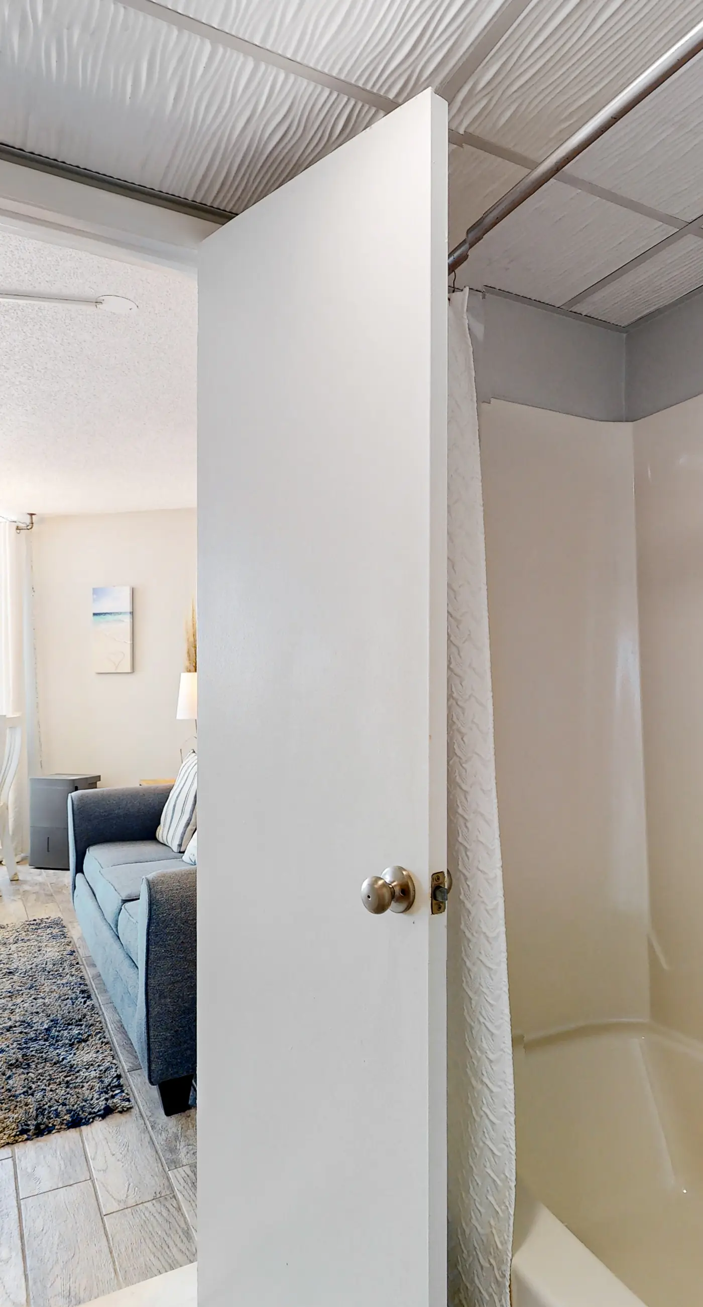 Gulf-view condo with pools, beach access, gym, grills, & updated interior