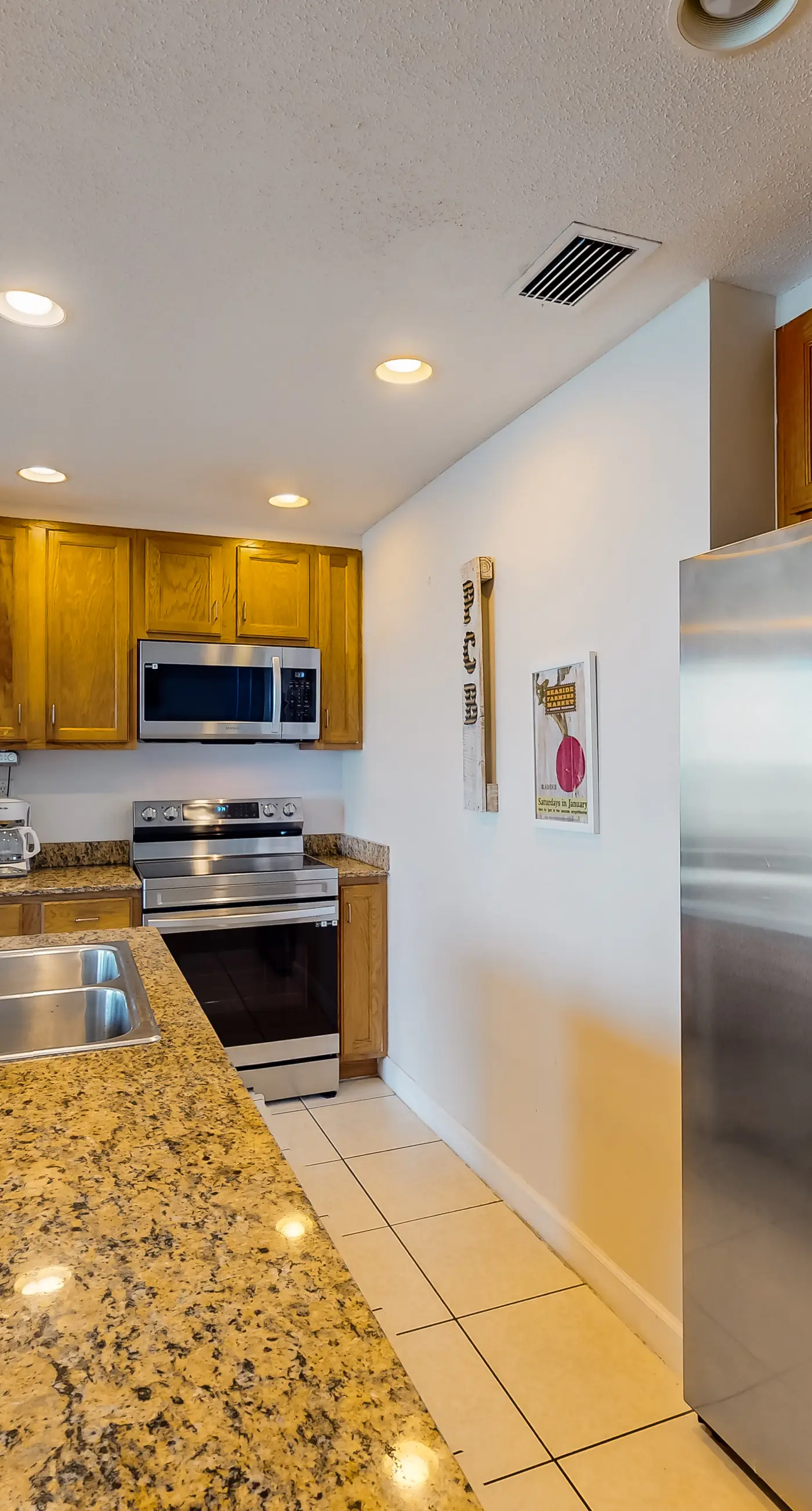 Waterfront condo with grills, pool & fitness center - walk to the beach