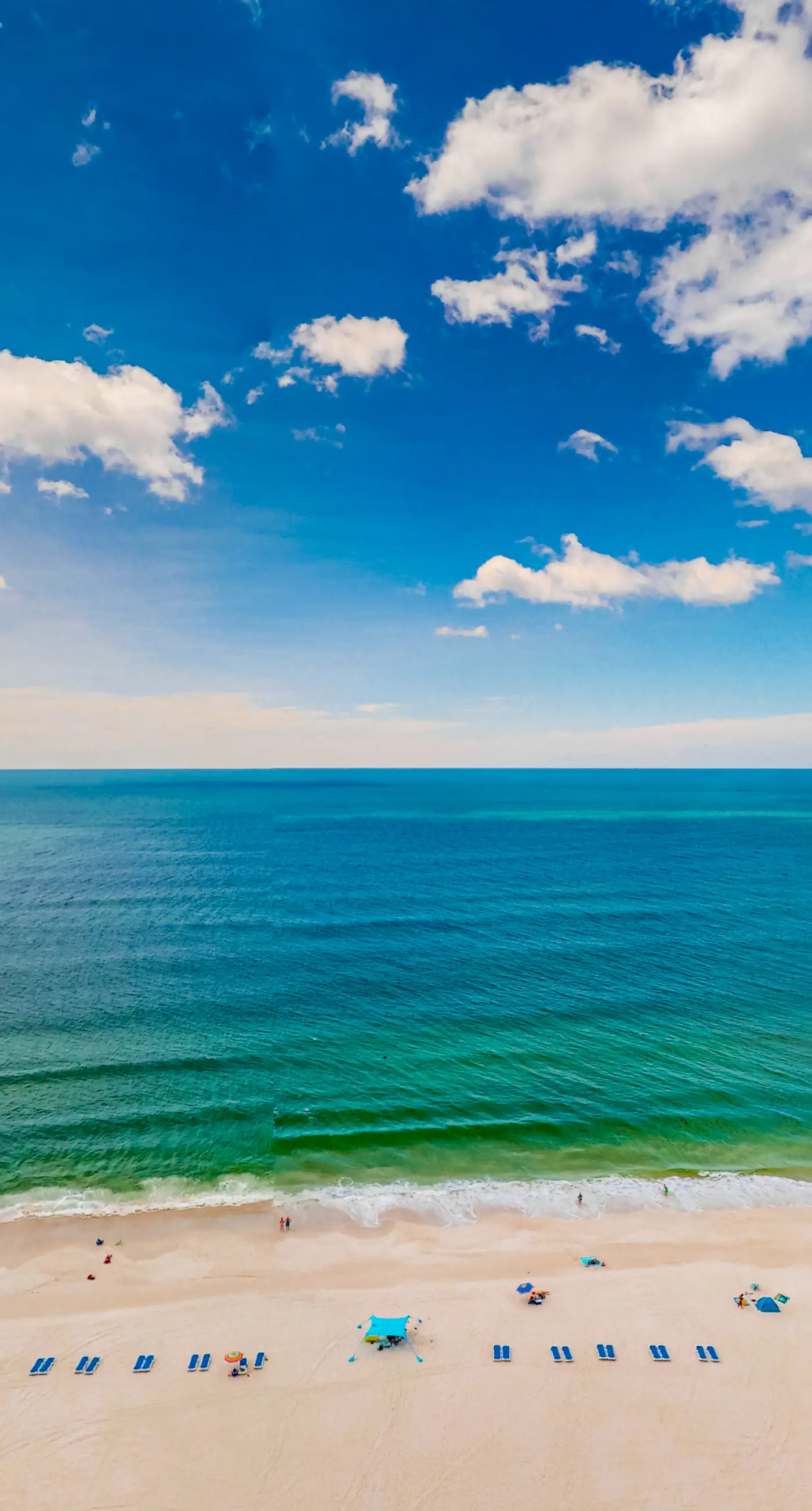 Waterfront condo with grills, pool & fitness center - walk to the beach