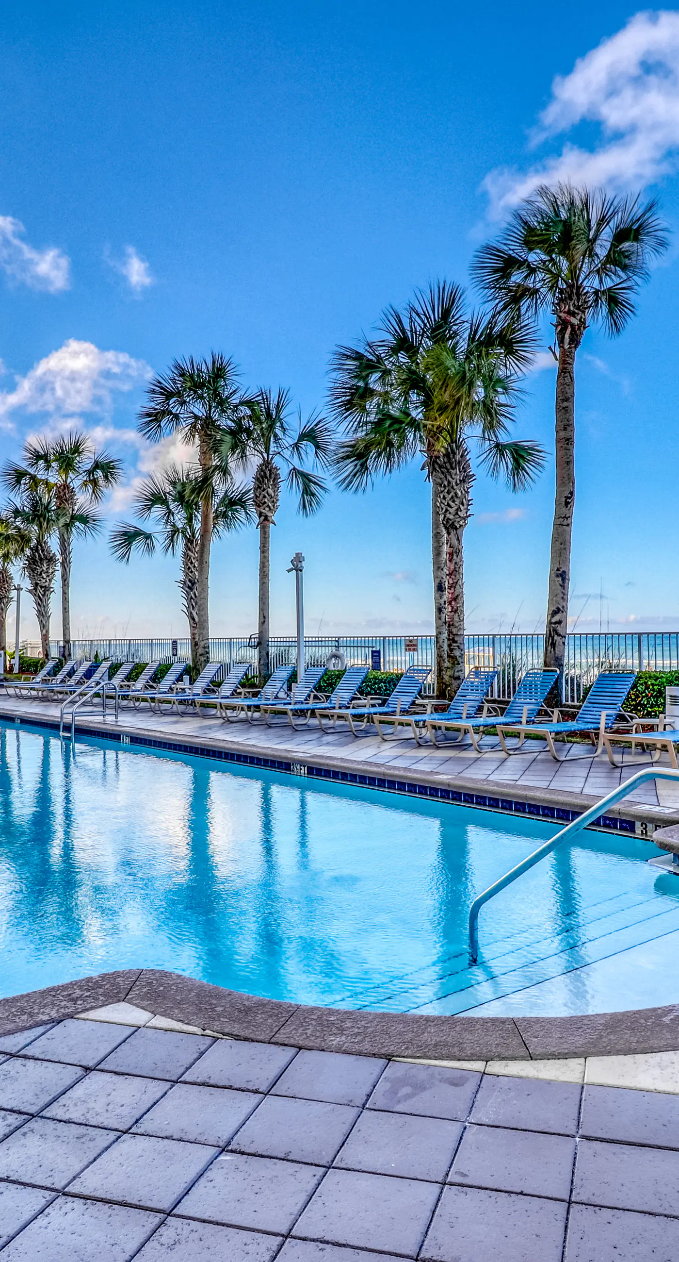 Waterfront condo with grills, pool & fitness center - walk to the beach