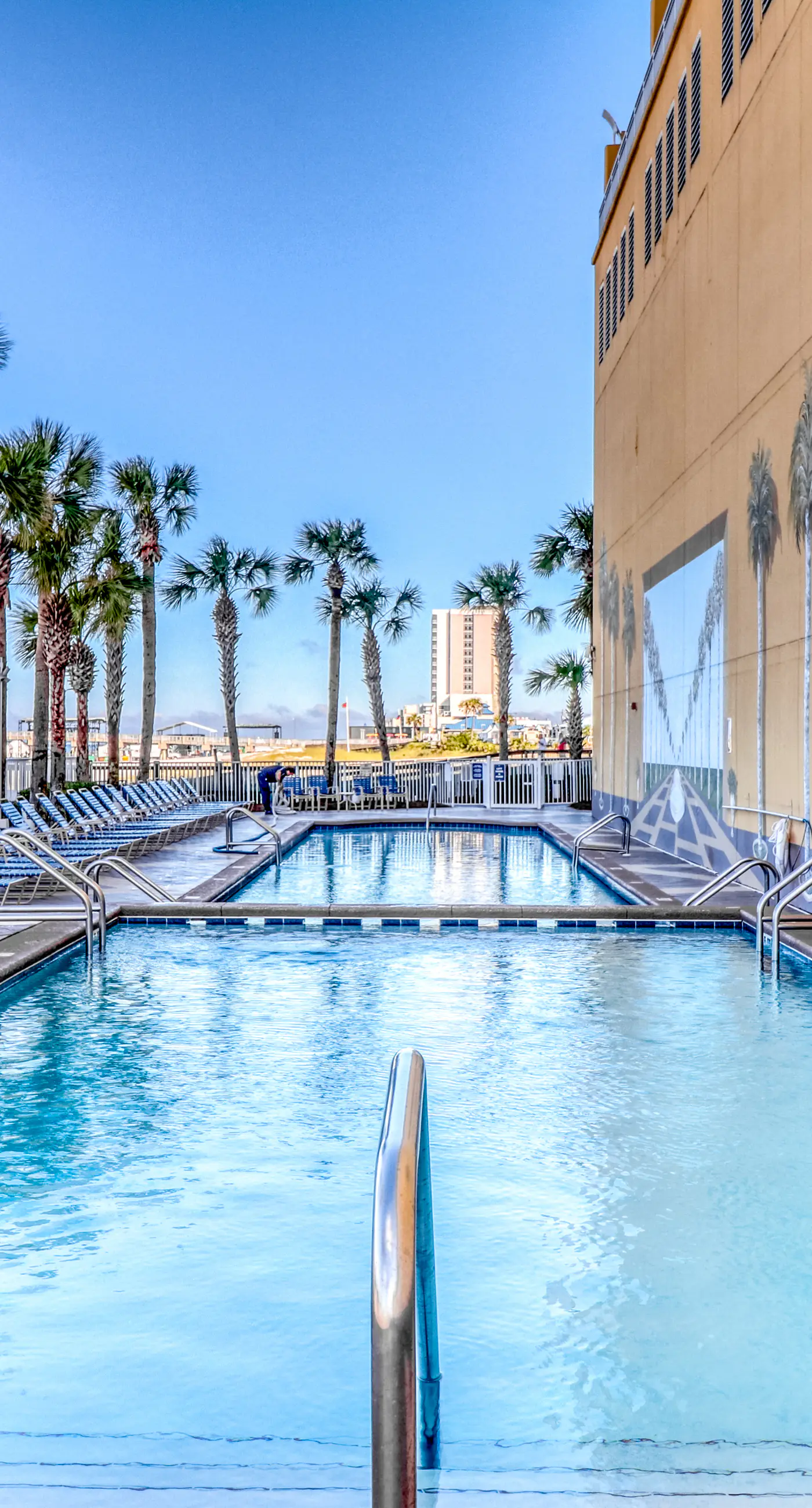 Waterfront condo with grills, pool & fitness center - walk to the beach