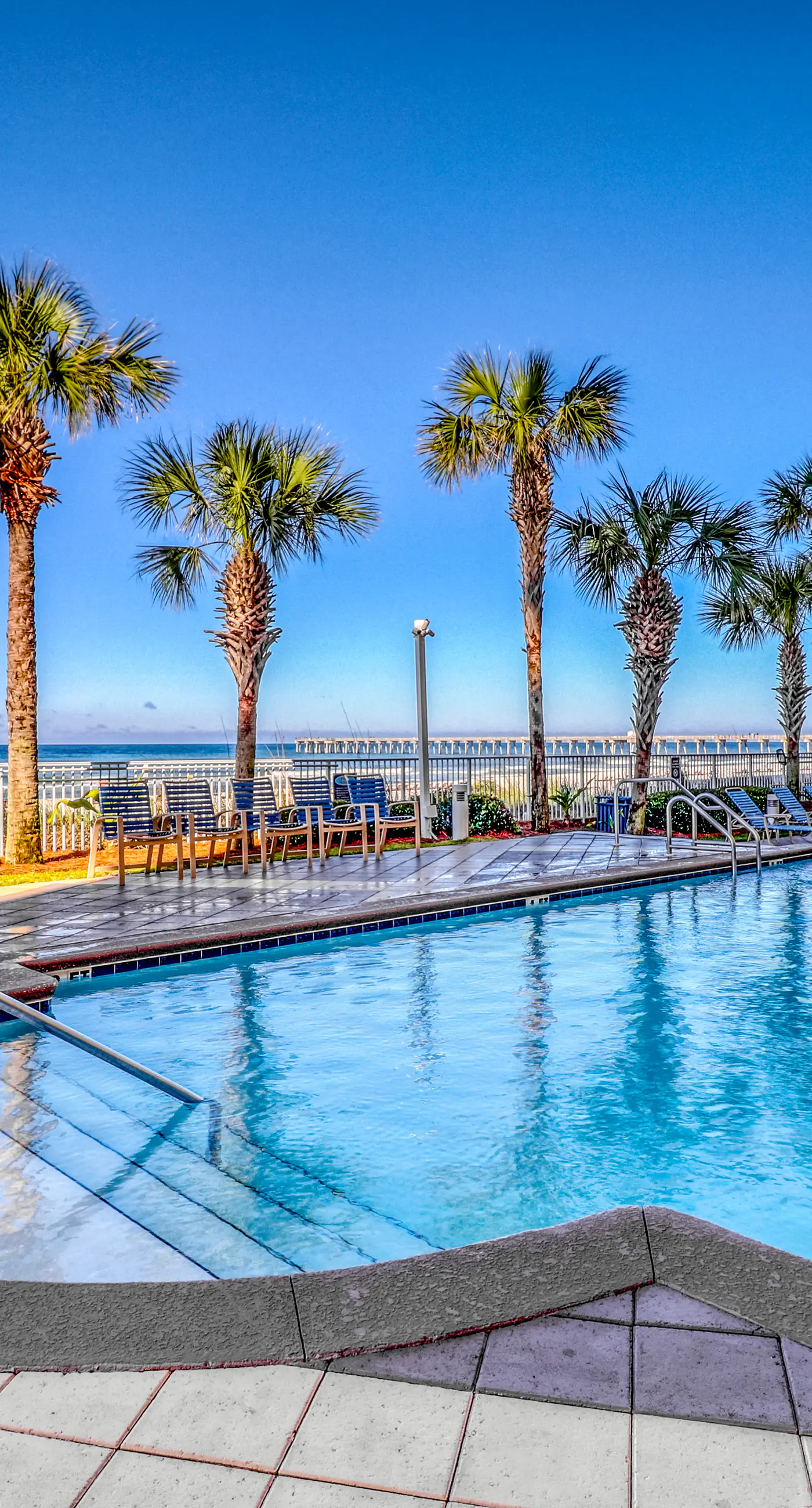 Waterfront condo with grills, pool & fitness center - walk to the beach
