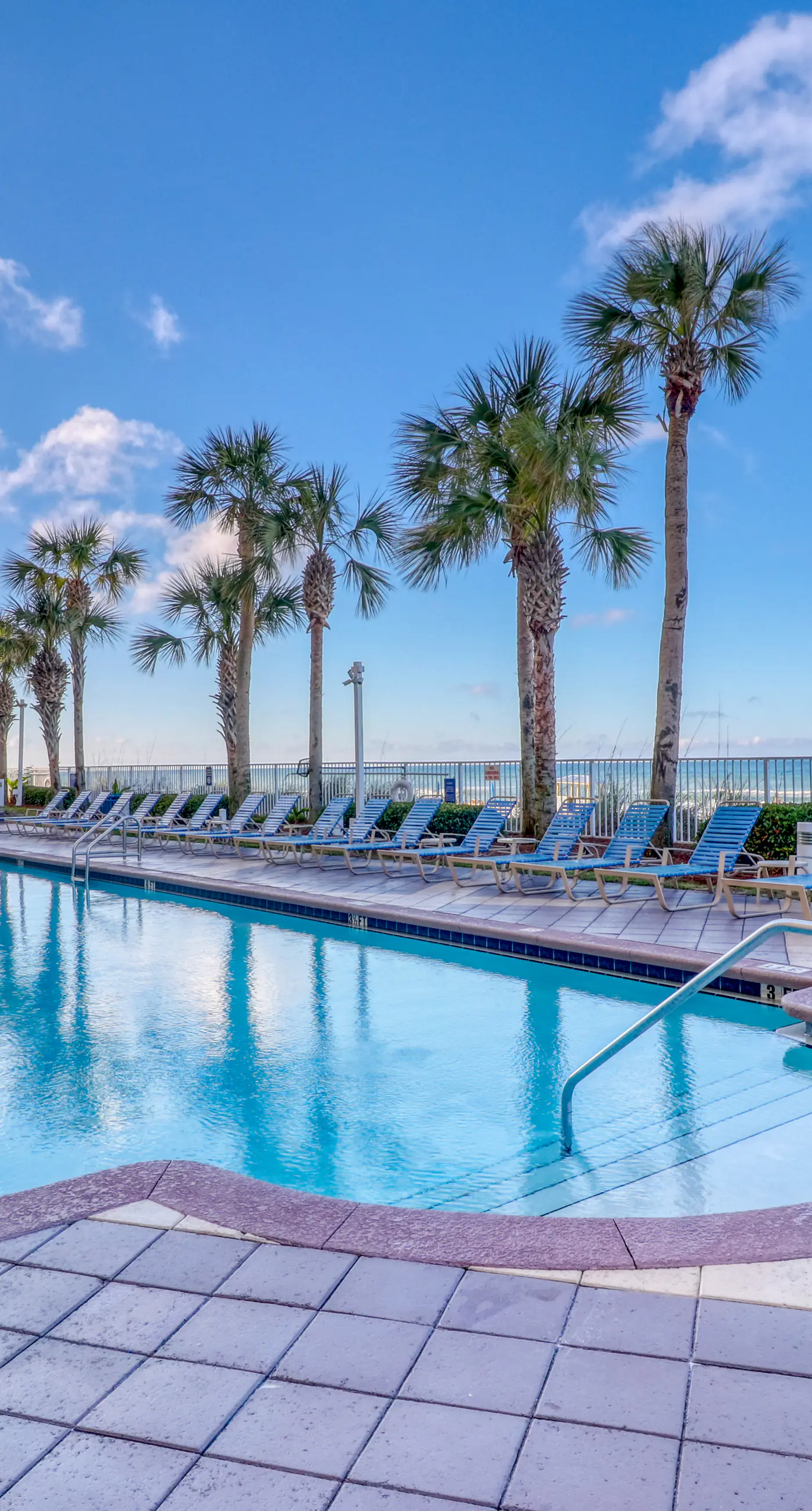Beachfront condo with amazing balcony views, pool & complimentary beach chairs