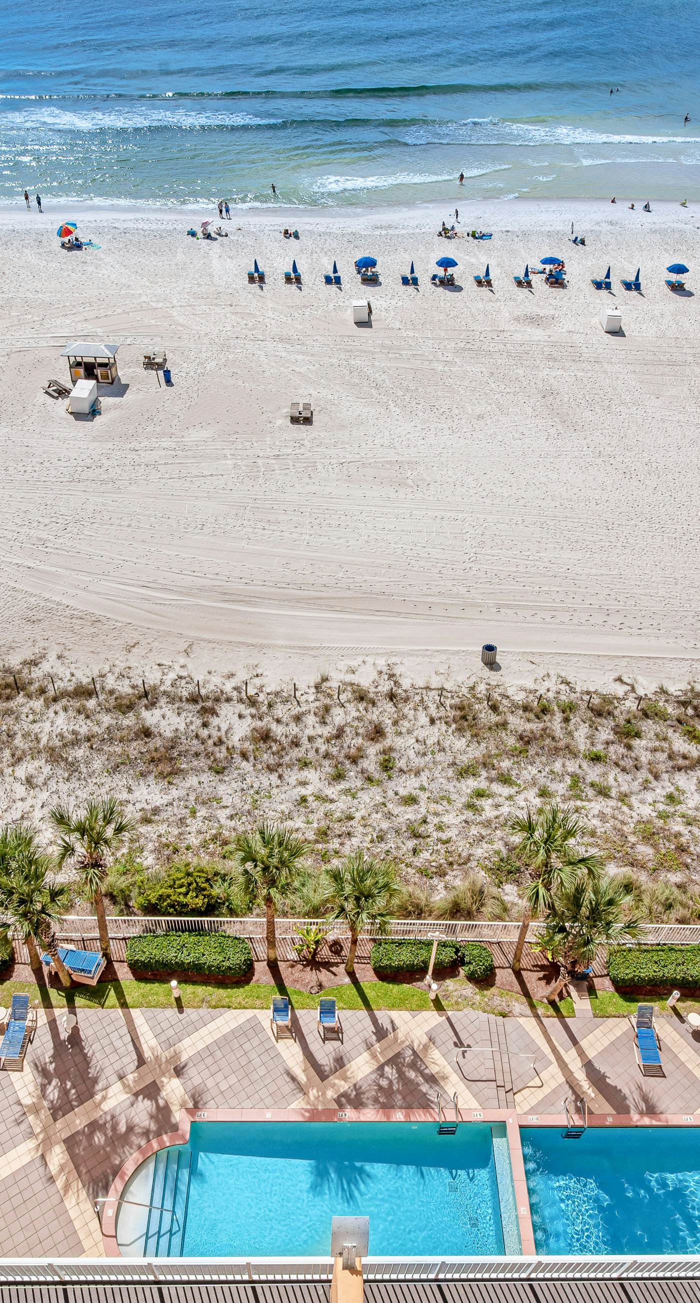 Tropical-themed condo with bi-level pool, fitness center & beach access