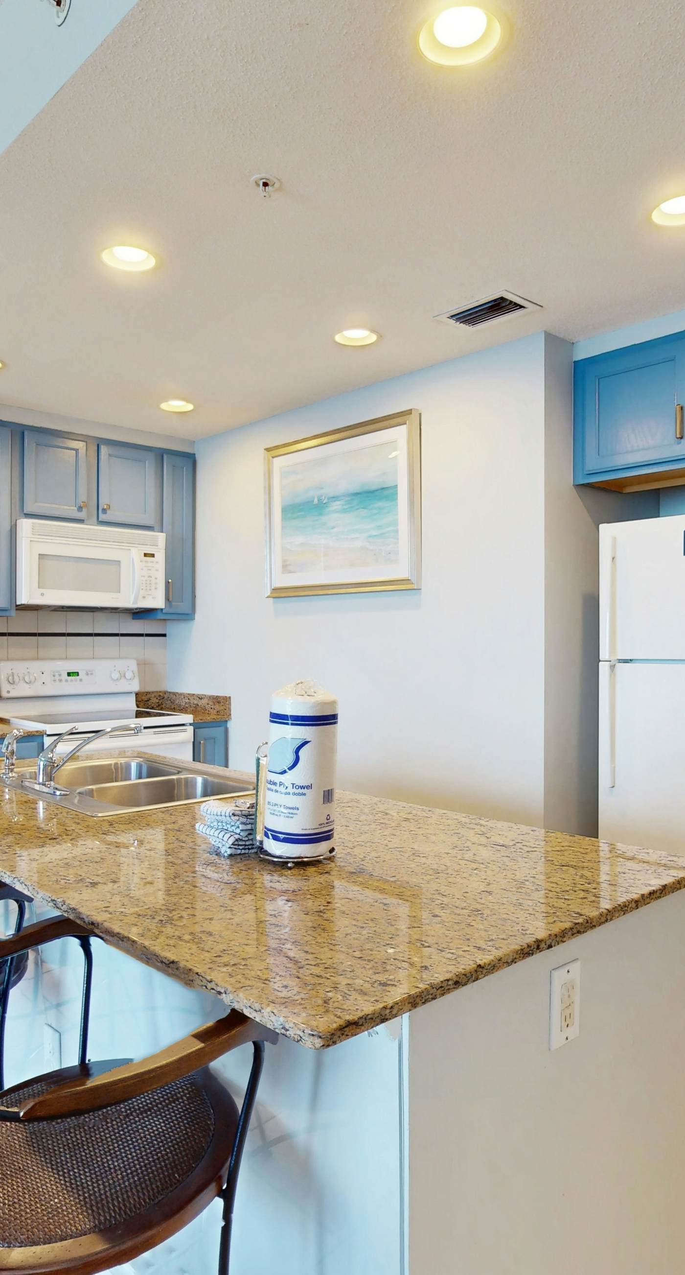 Tropical-themed condo with bi-level pool, fitness center & beach access