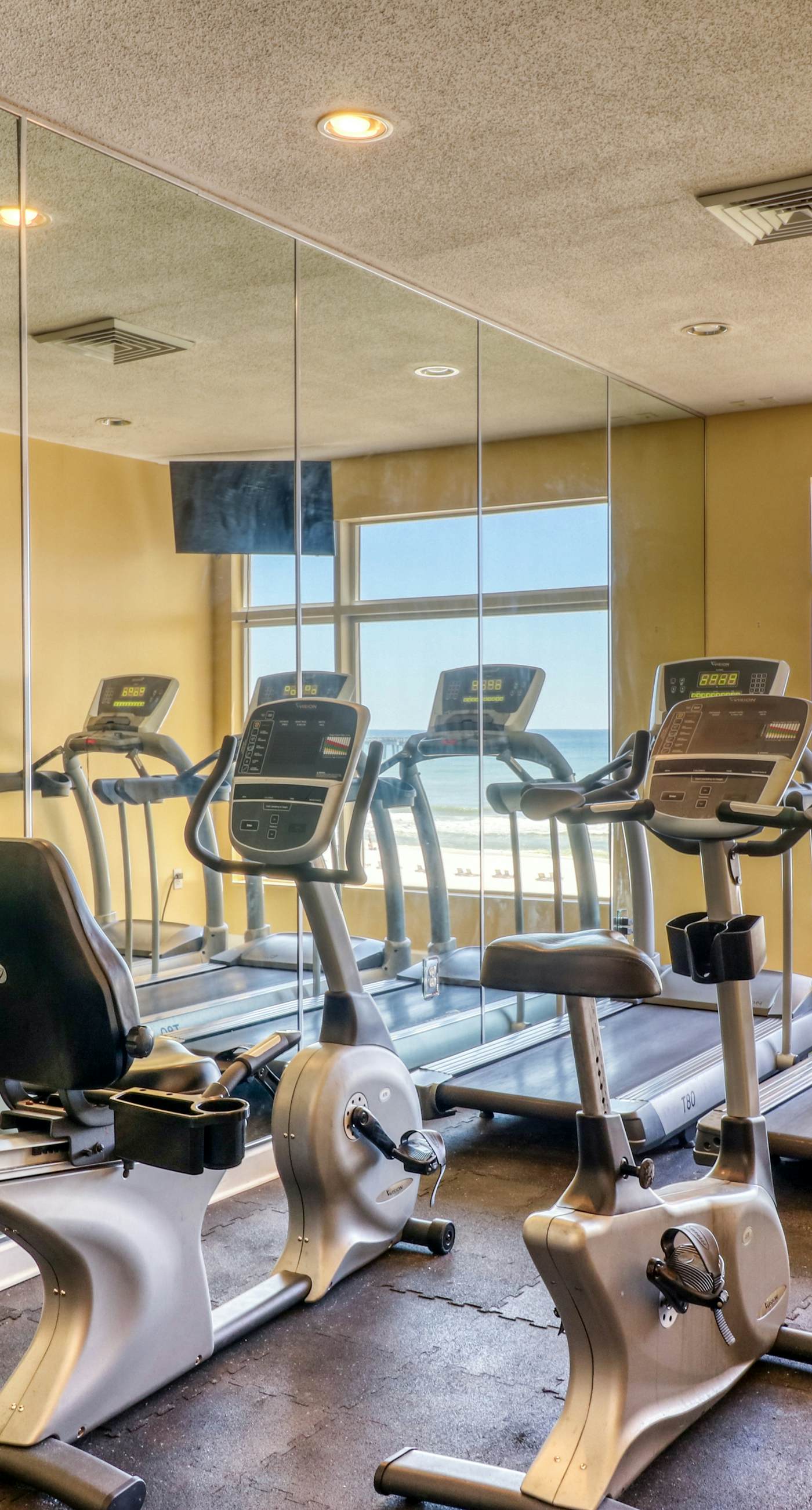 Tropical-themed condo with bi-level pool, fitness center & beach access