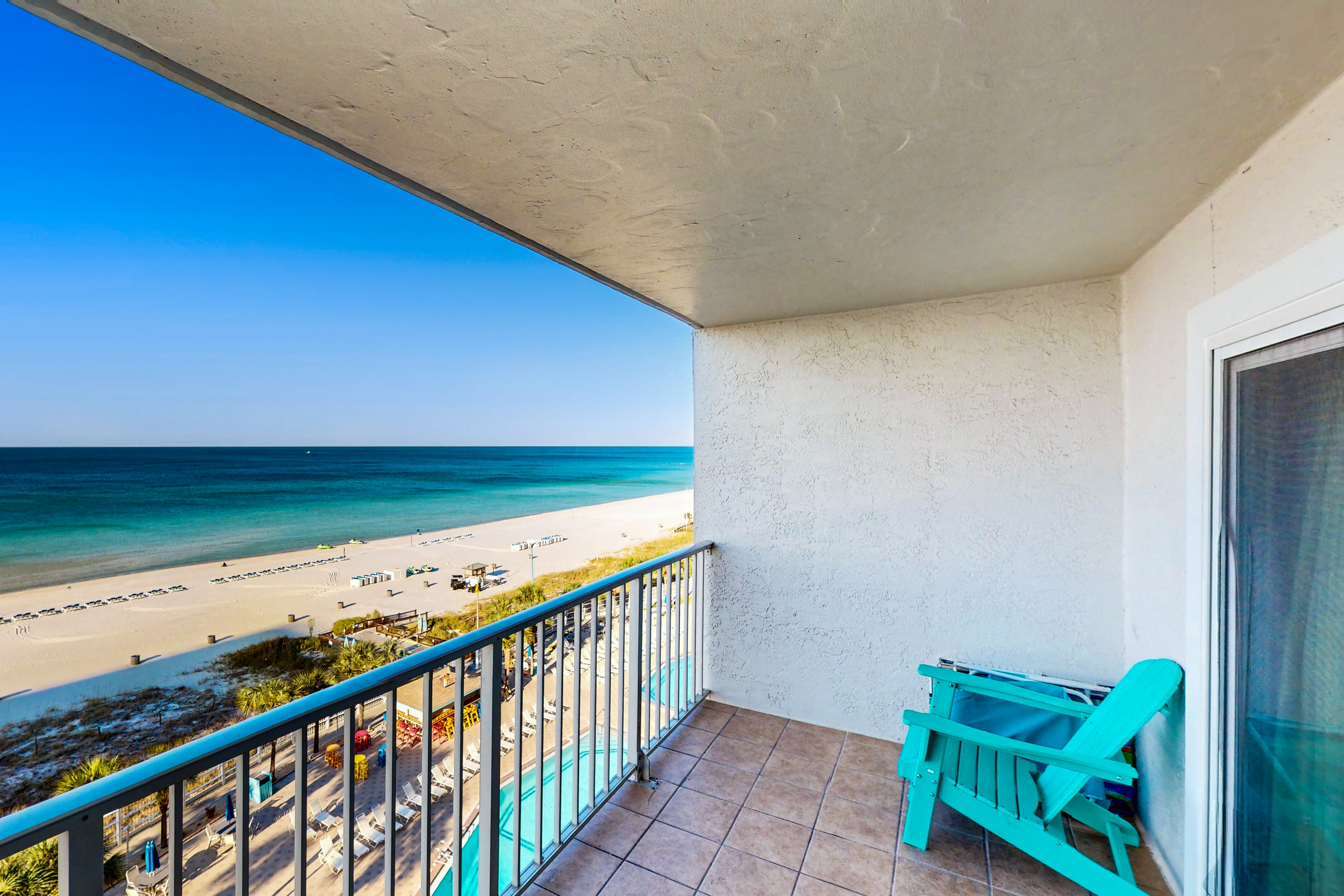 Gulf-front condo with balcony, W/D, direct beach access, pools, hot tub & gym