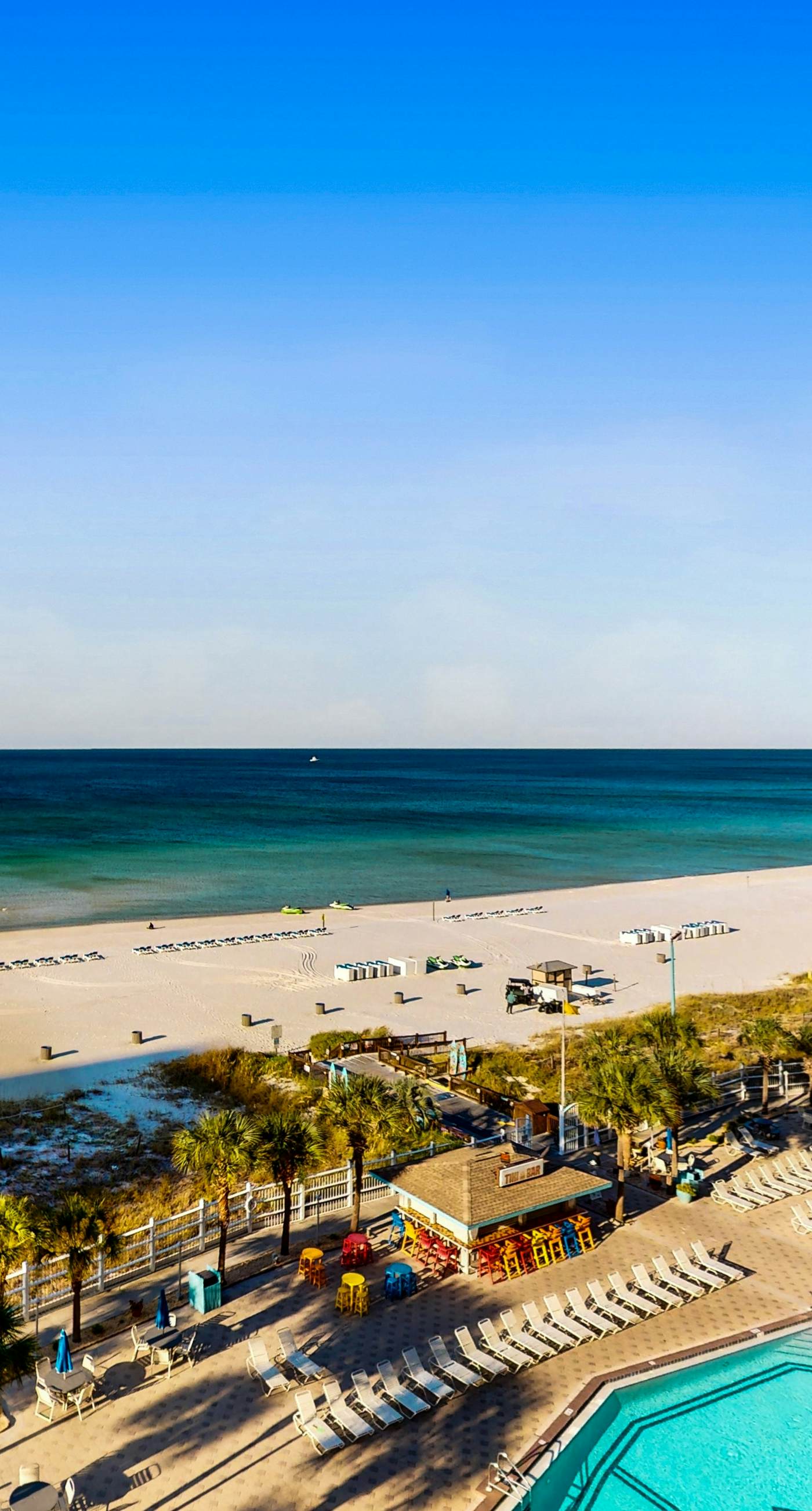 Gulf-front condo with balcony, W/D, direct beach access, pools, hot tub & gym