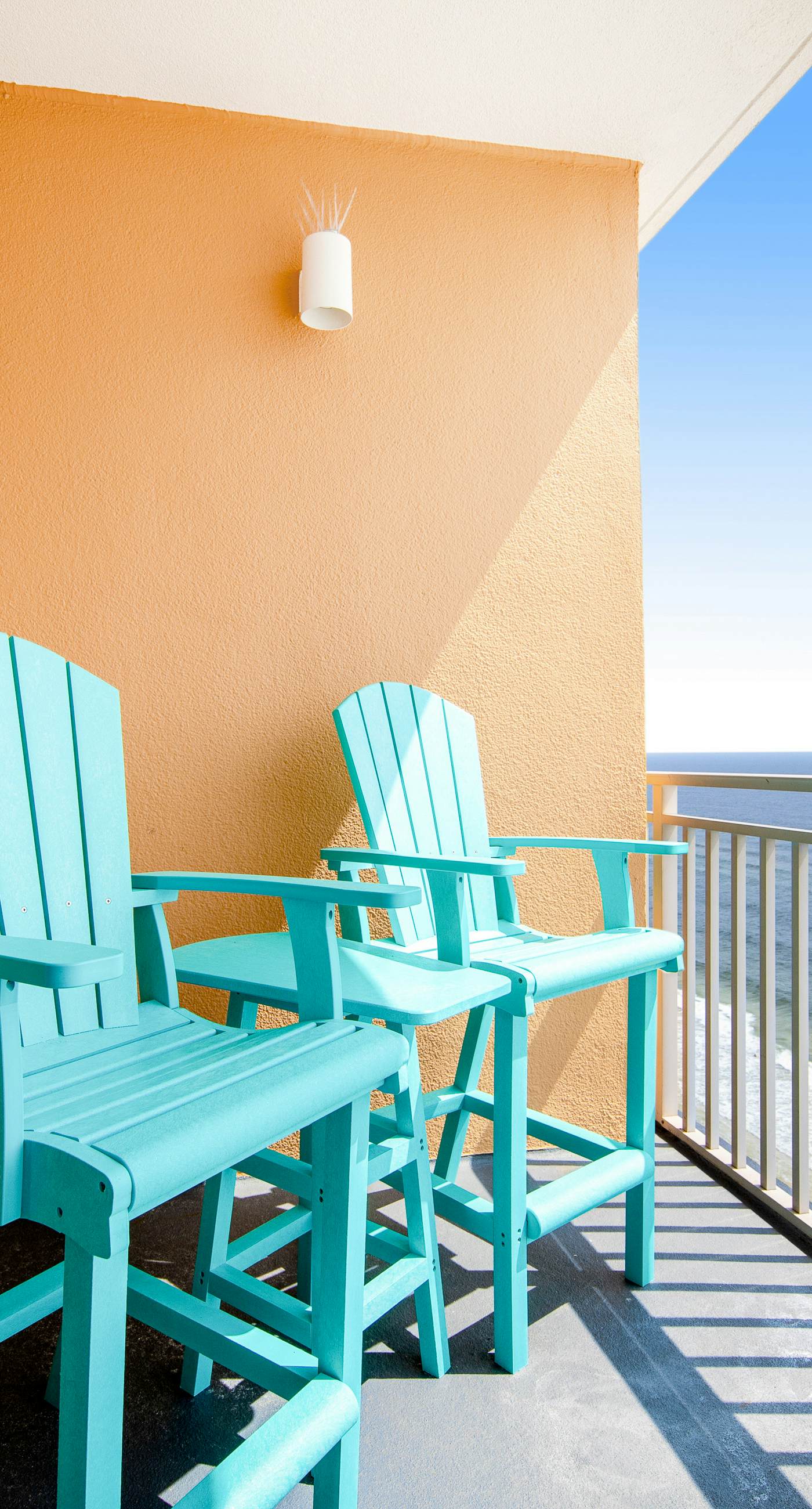 Colorful, beachfront condo with Gulf view, pool, hot tub, and lazy river