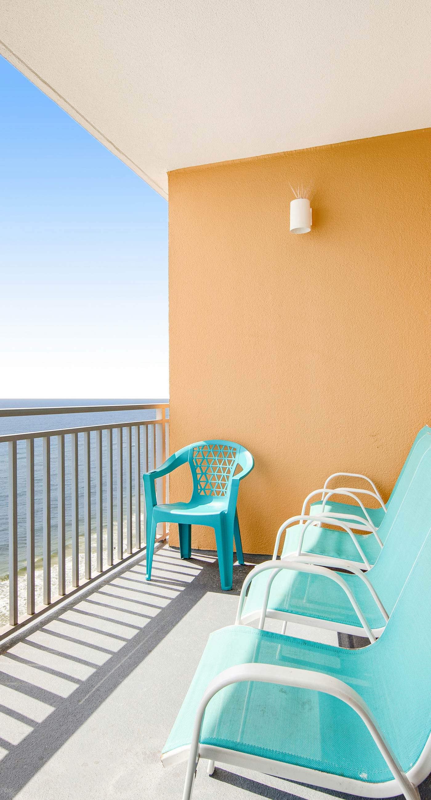 Colorful, beachfront condo with Gulf view, pool, hot tub, and lazy river