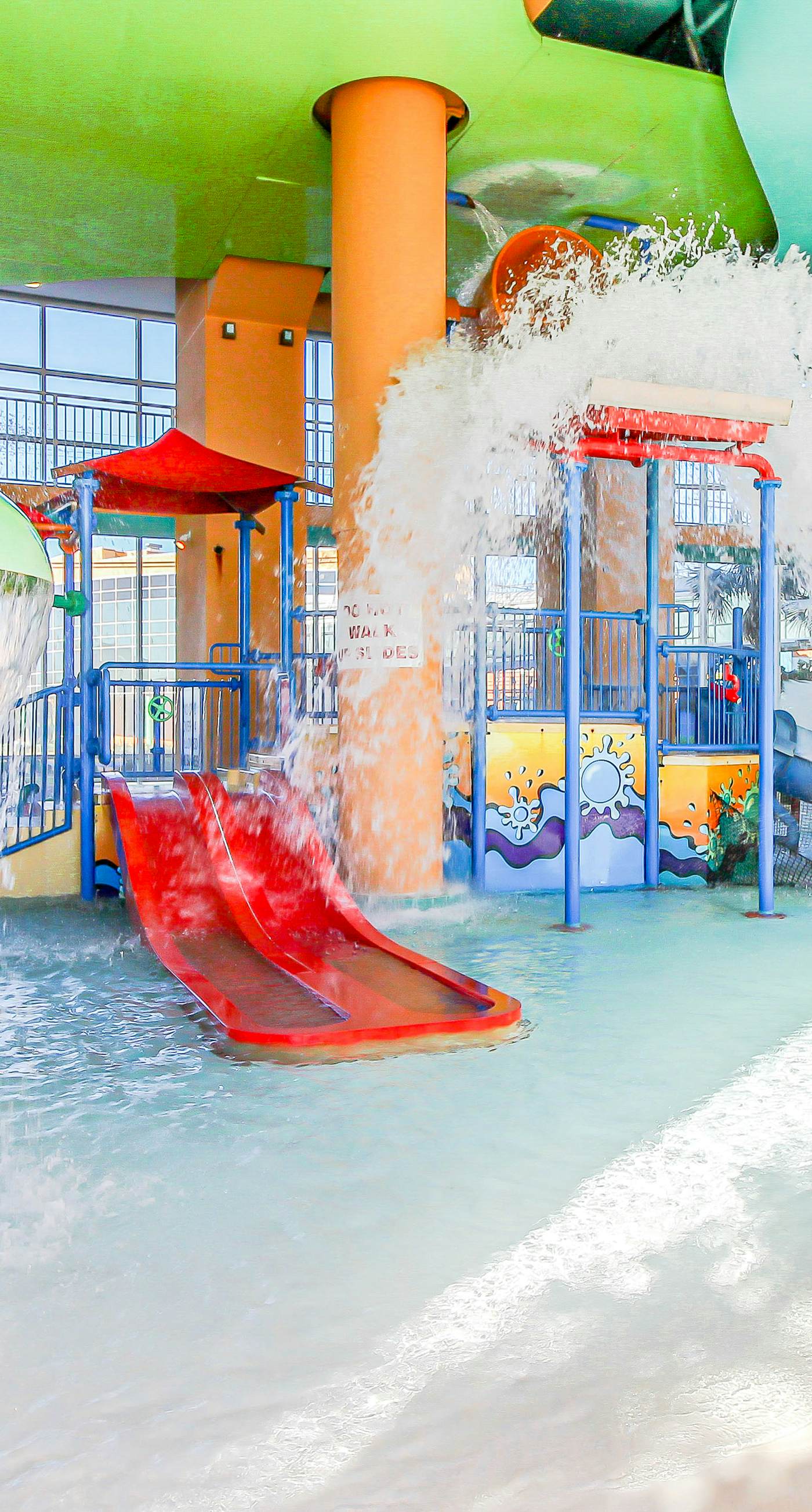 Colorful, beachfront condo with Gulf view, pool, hot tub, and lazy river