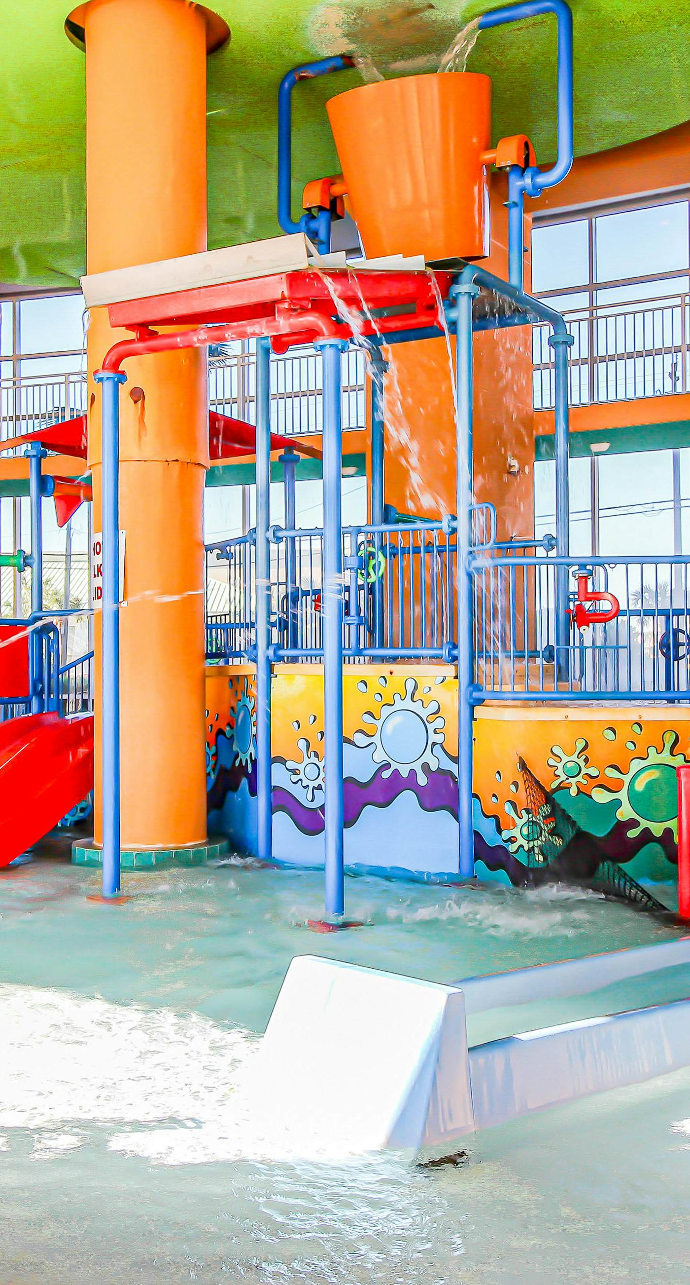 Colorful, beachfront condo with Gulf view, pool, hot tub, and lazy river