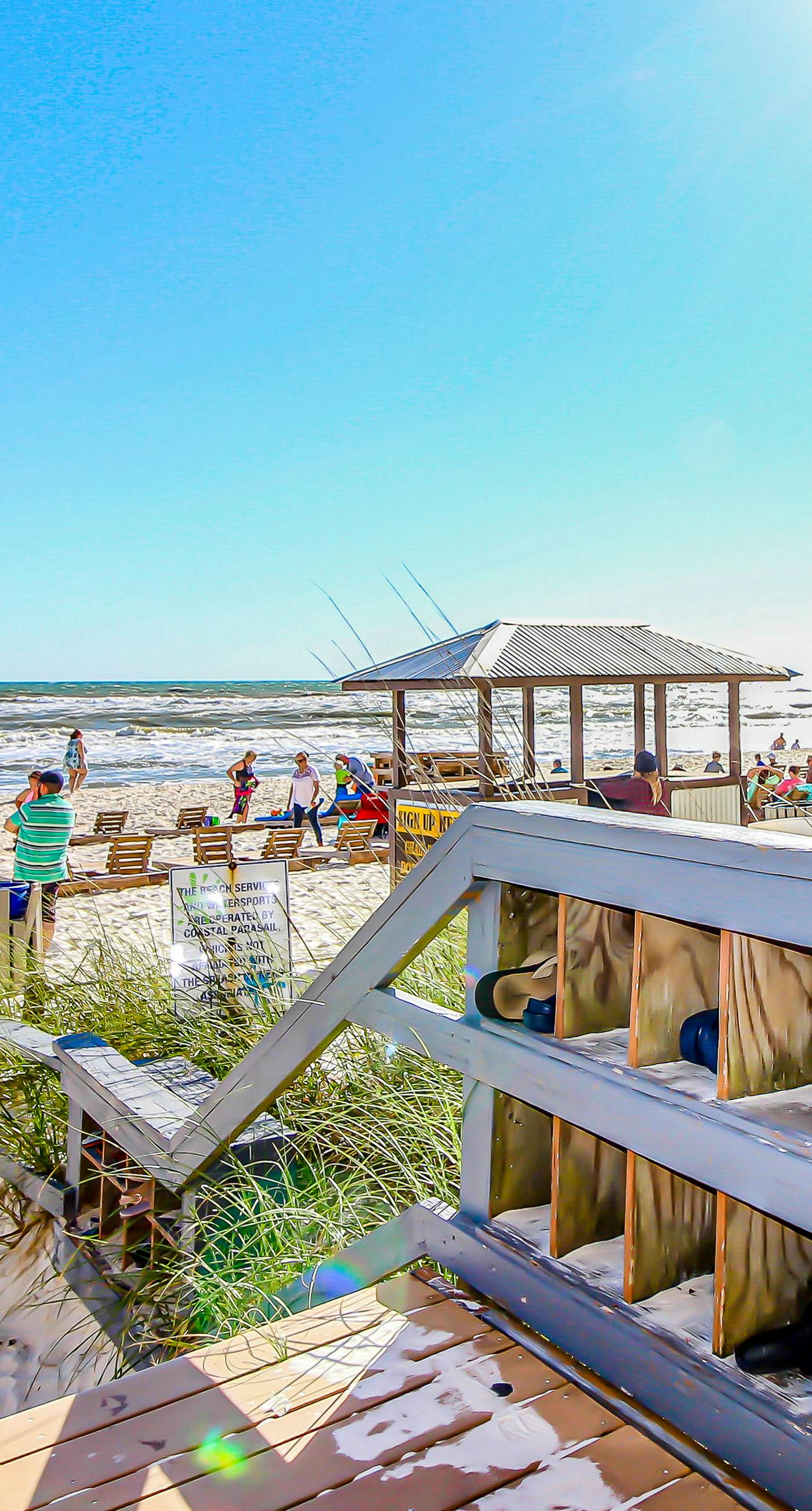Colorful, beachfront condo with Gulf view, pool, hot tub, and lazy river