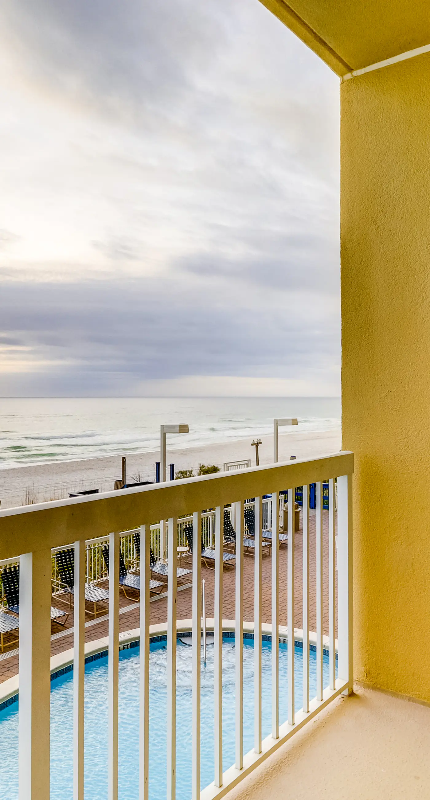 Stunning condo with Gulf view, balcony, hot tub, & pool