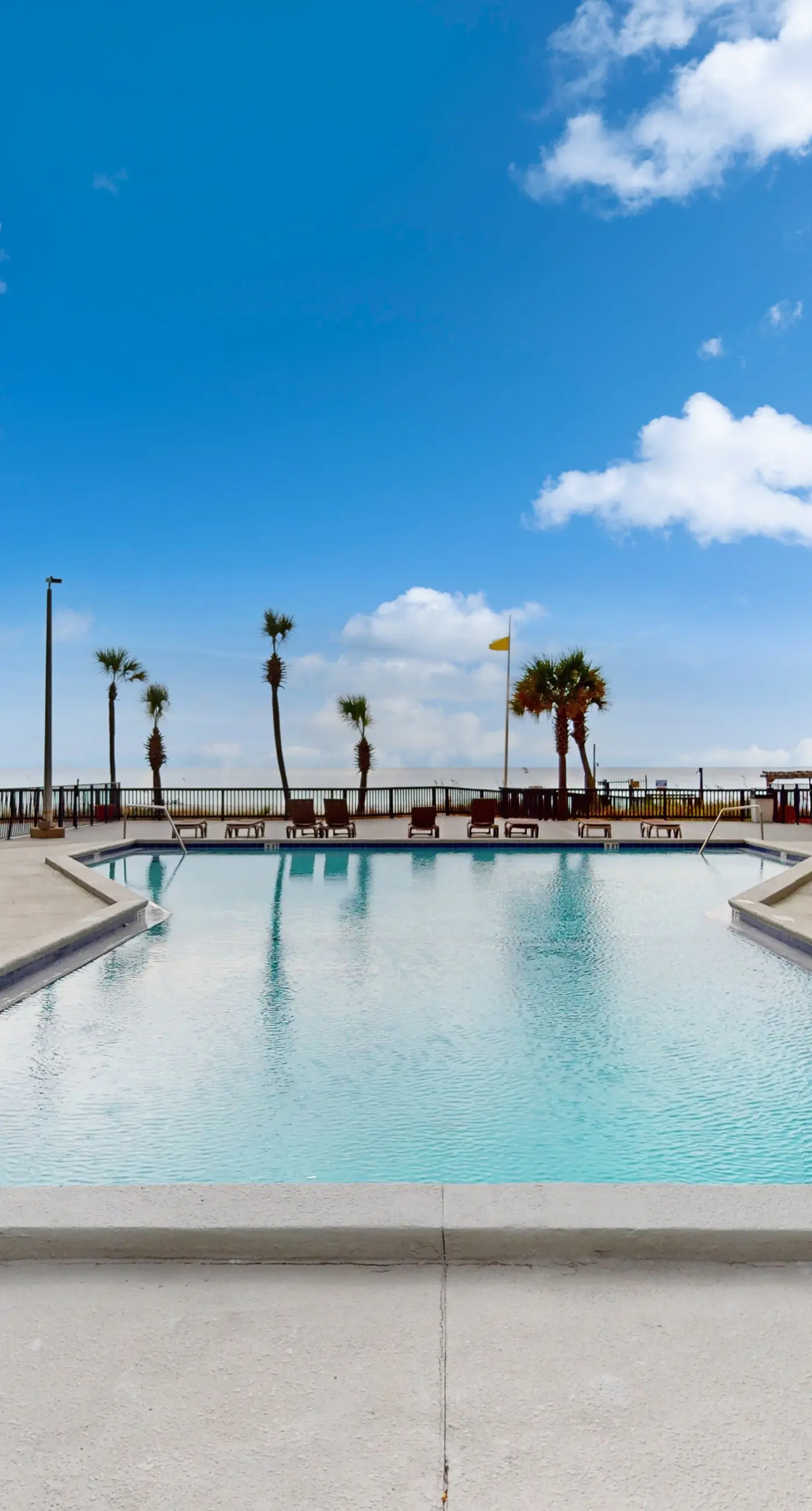 Gulf-view condo with furnished balcony, pools, beach access, fitness room