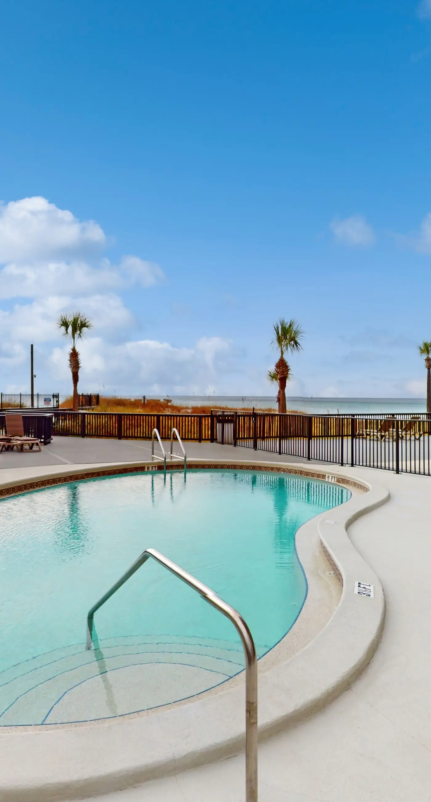 Gulf-view condo with furnished balcony, pools, beach access, fitness room