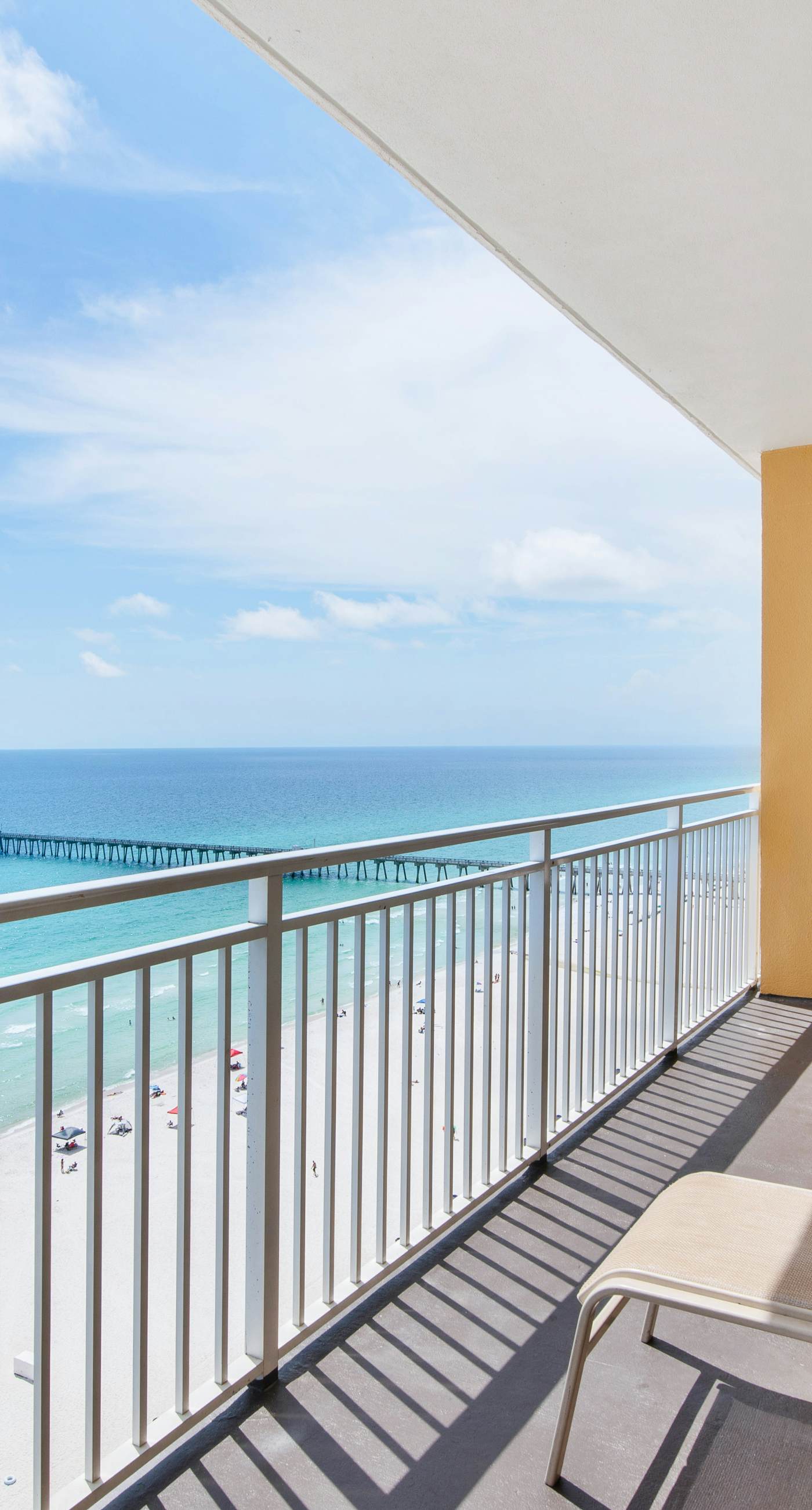 Sunny getaway at the beach with furnished balcony, pool & fitness room