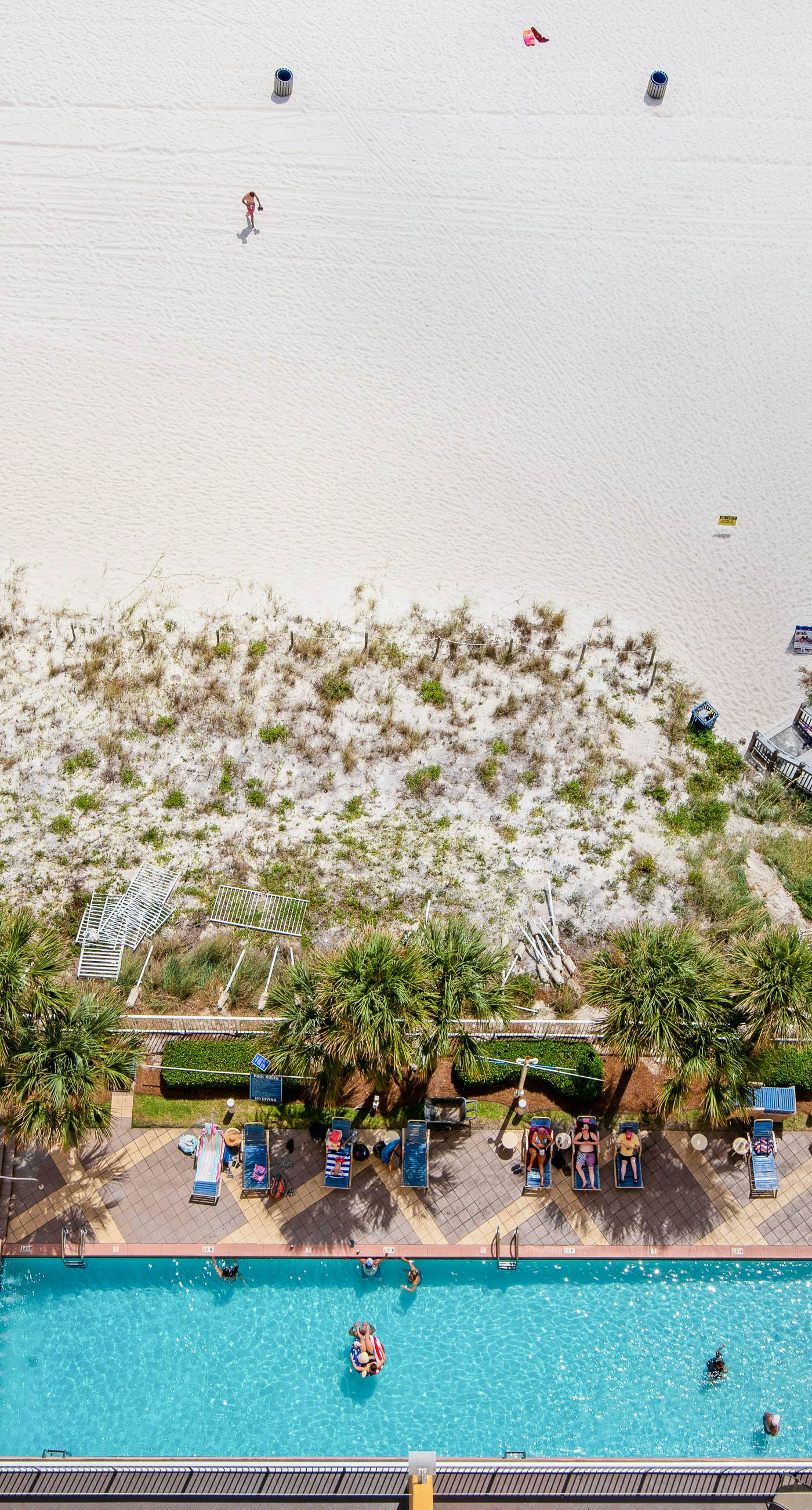 Sunny getaway at the beach with furnished balcony, pool & fitness room