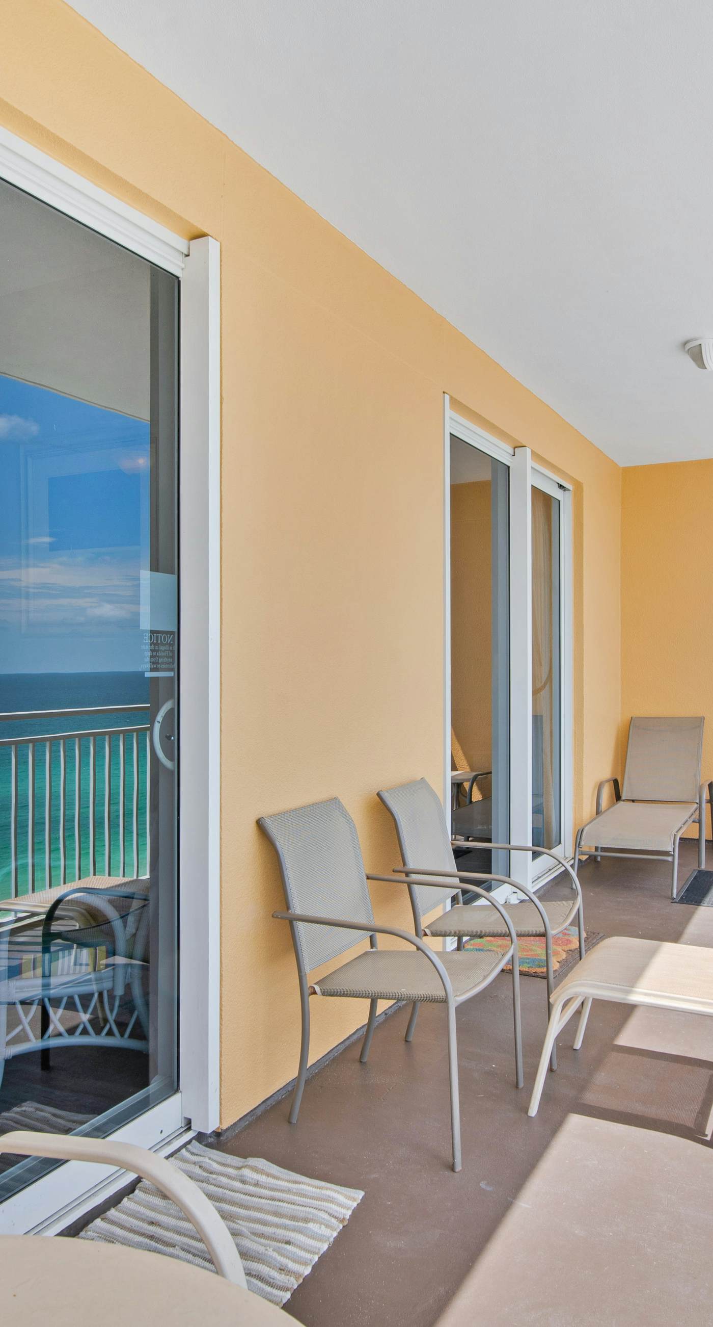 Sunny getaway at the beach with furnished balcony, pool & fitness room