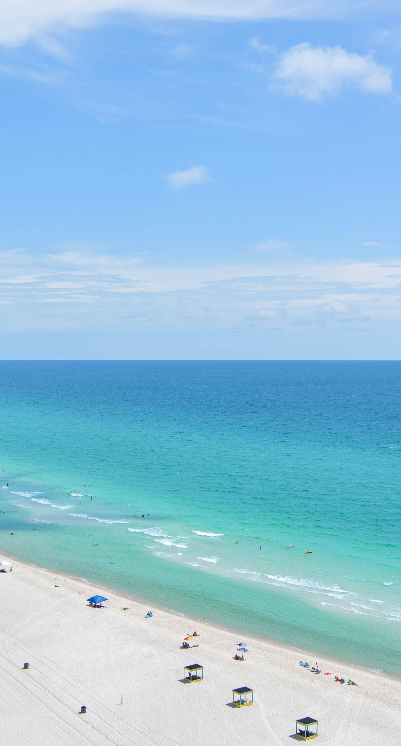 Sunny getaway at the beach with furnished balcony, pool & fitness room